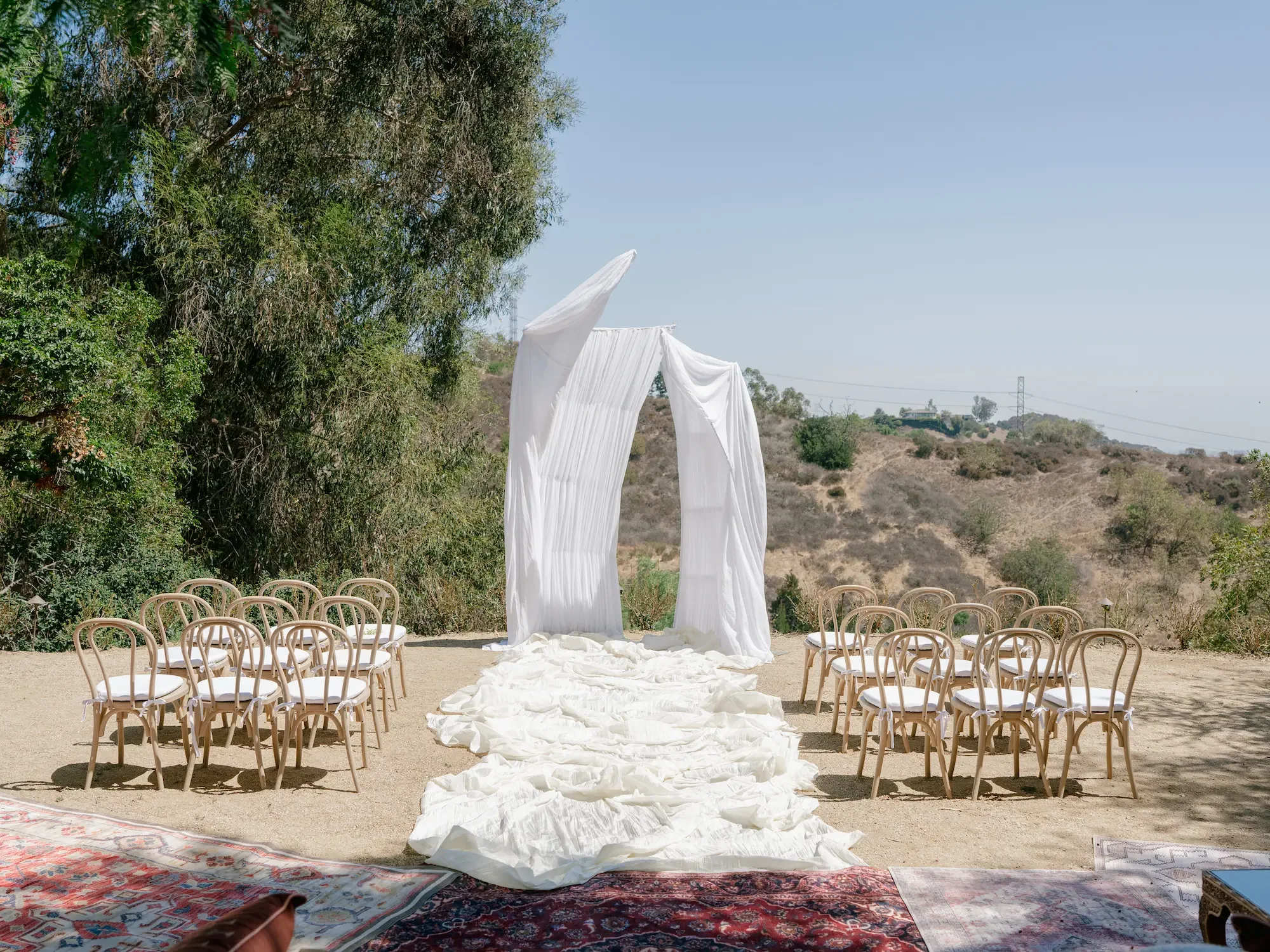 Contemporary wedding altar design in Vista Grove with open hillside and city views.