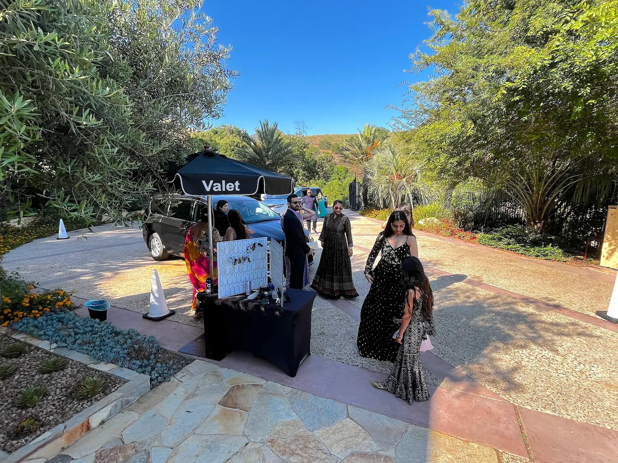 Valet welcoming arriving guests in the Star Motor Court at XOHH Events in the Hollywood Hills.