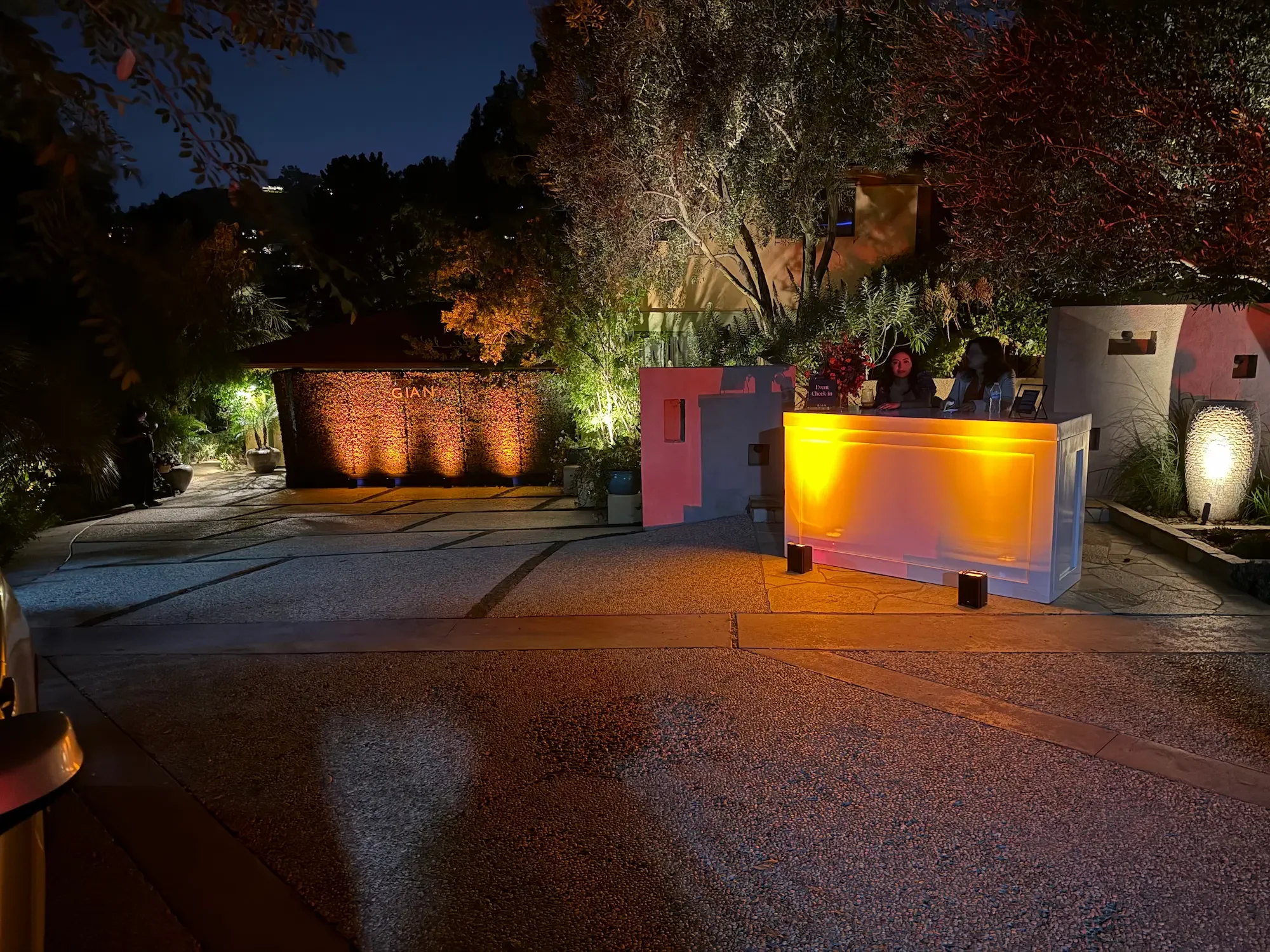Illuminated driveway entrance welcoming guests to an evening event at XOHH Events.