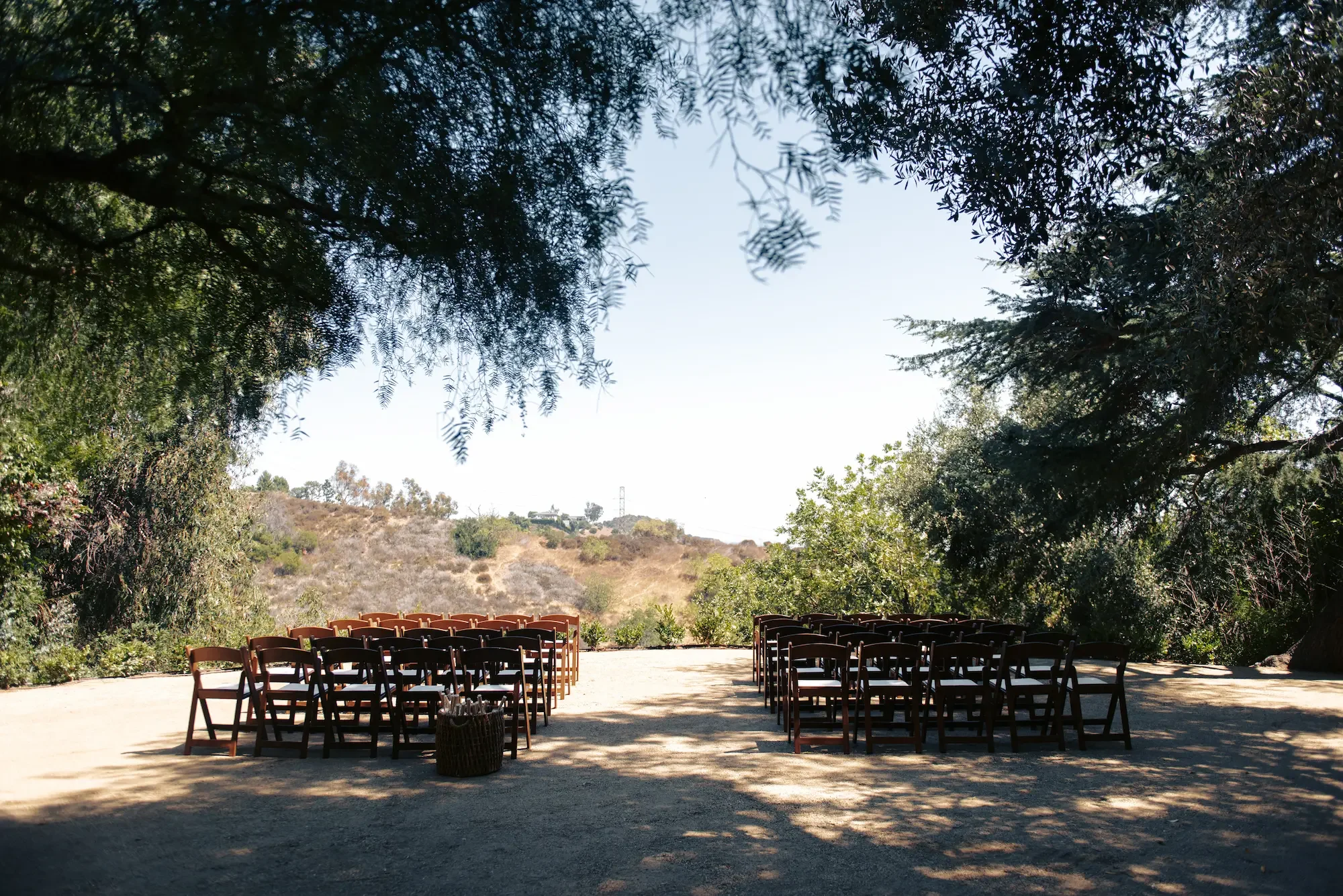 Guest seating arranged in Vista Grove for a wedding ceremony overlooking the Hollywood Hills and city views.