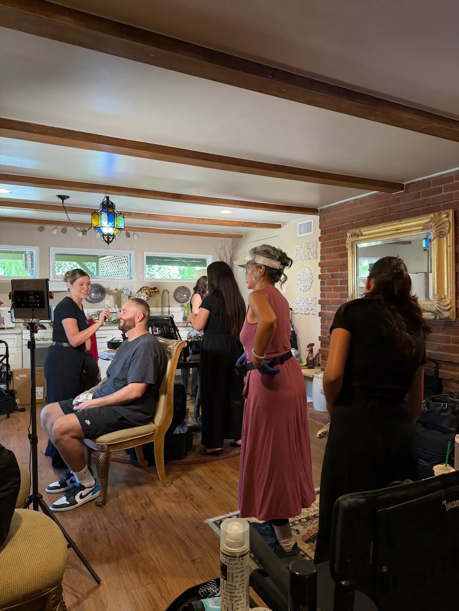 Hair and makeup artists preparing cast members in the Apartment Suite at XOHH Events, an indoor production support space at this Hollywood Hills filming location.