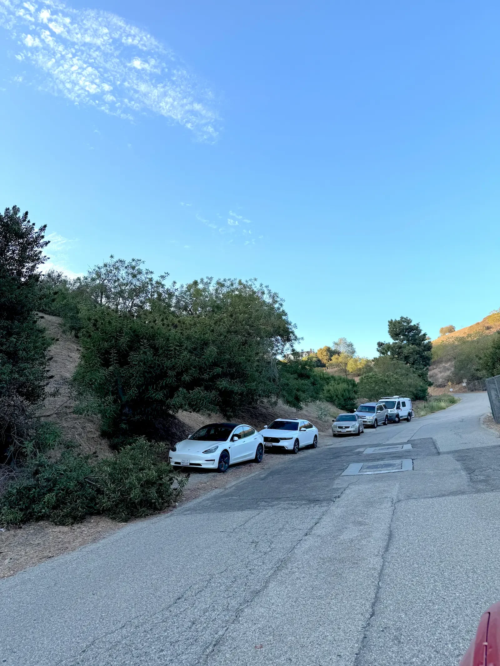 Cars lined up along Wonder View Drive near XOHH Events in the Hollywood Hills.