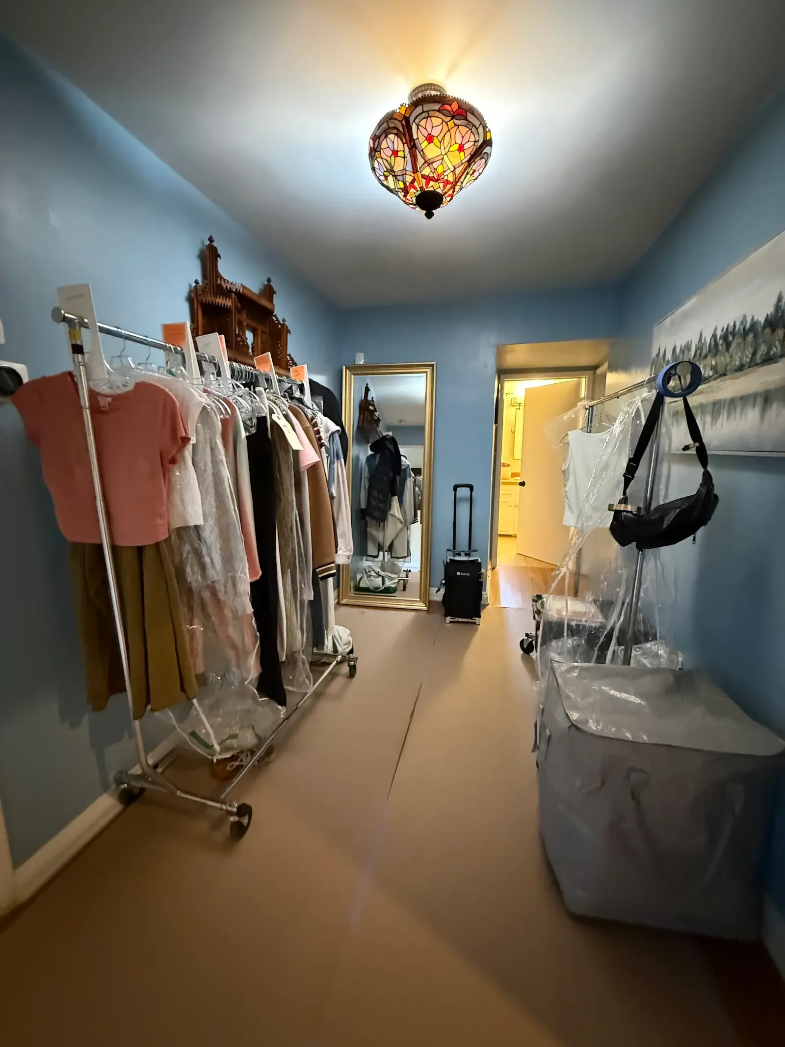 Apartment Suite hallway arranged with wardrobe racks and clothing for the Helen Mirren production.