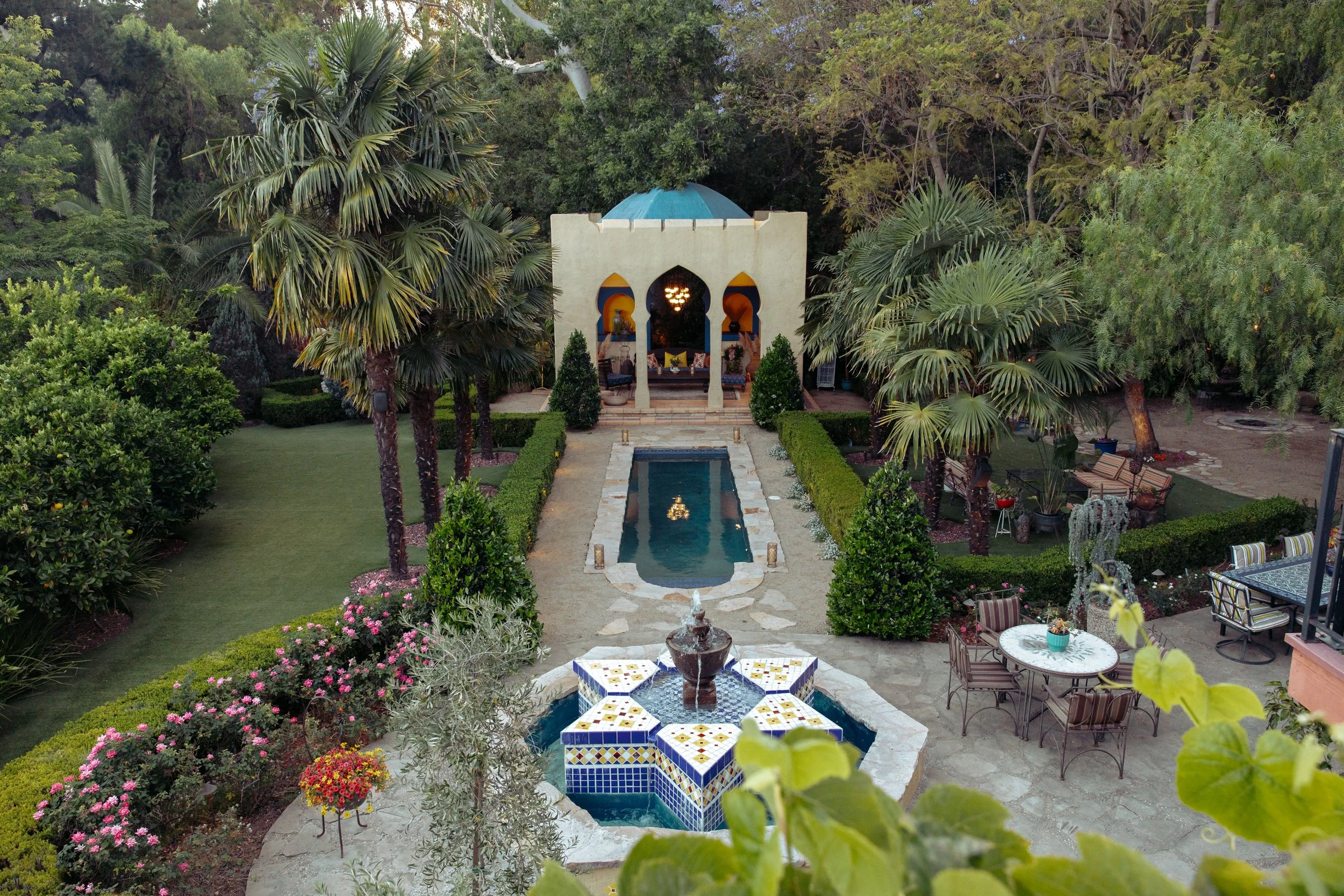 Aerial view of the Moroccan-inspired Kasbah pavilion and reflecting pool at XOHH Estate in the Hollywood Hills, surrounded by gardens and event spaces for weddings, private events, photo shoots, and film productions.