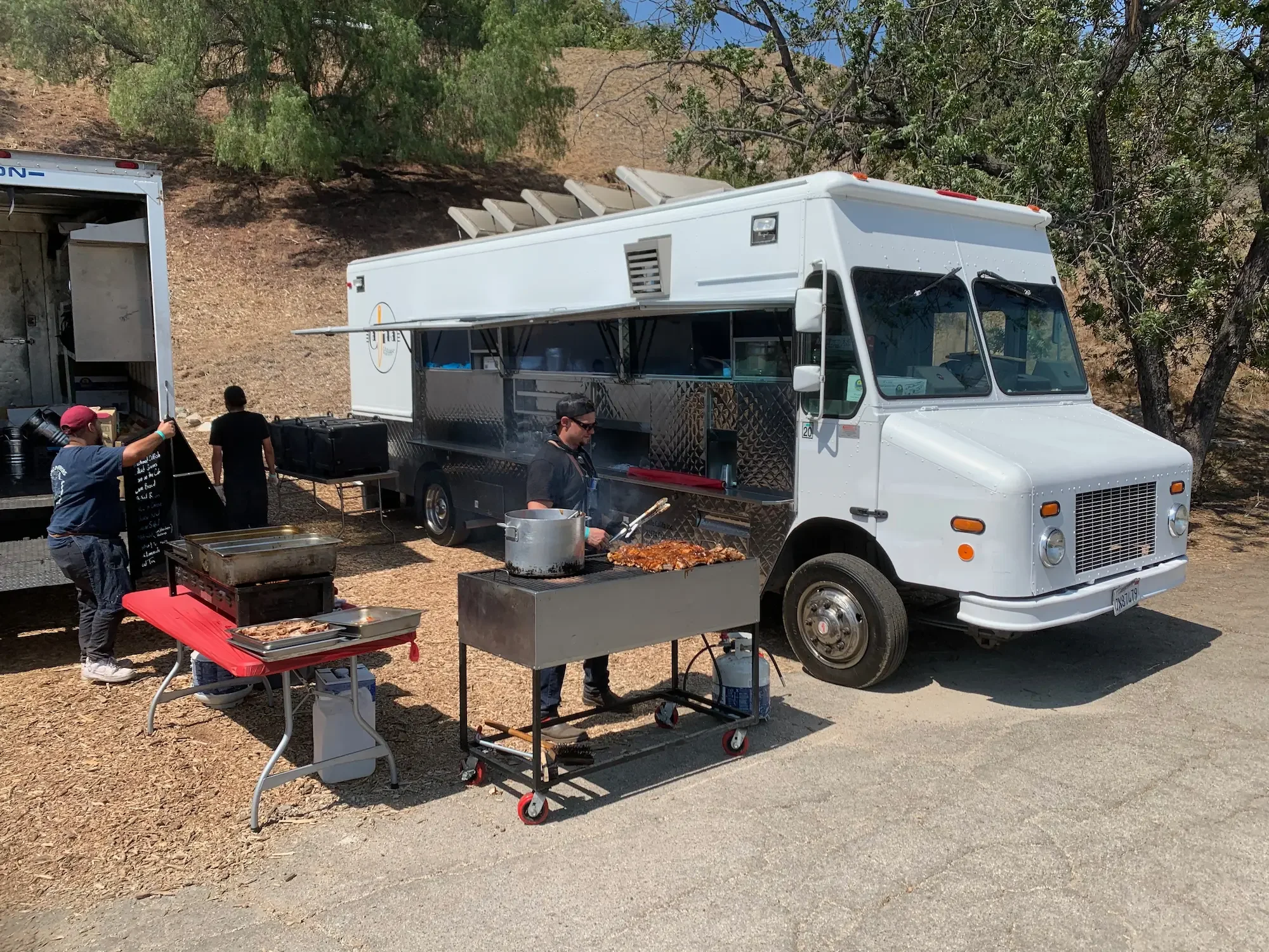 Production truck and equipment staged on the driveway at XOHH Events, a private Hollywood Hills film location.