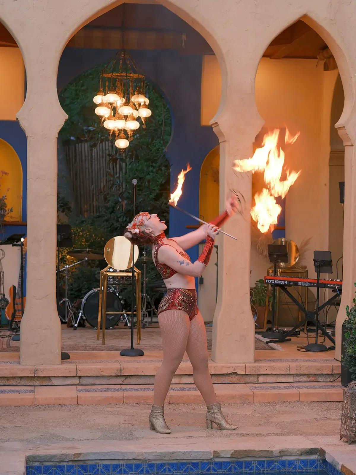 Fire performer entertaining beside the Moroccan-inspired Kasbah at XOHH Events in Los Angeles