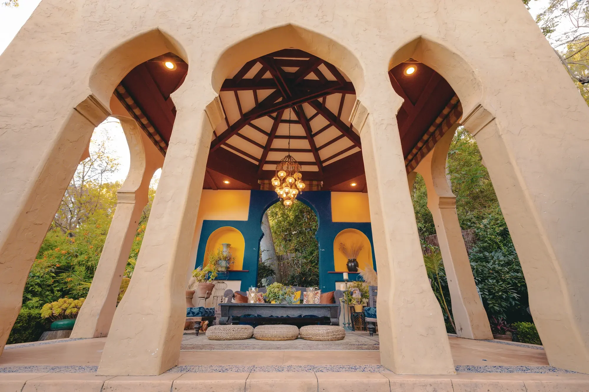 Kasbah at XOHH Events in the Hollywood Hills, featuring eight tall Moroccan arches, a geometric dome ceiling, hanging chandelier, vibrant colors, and furnished lounge seating.