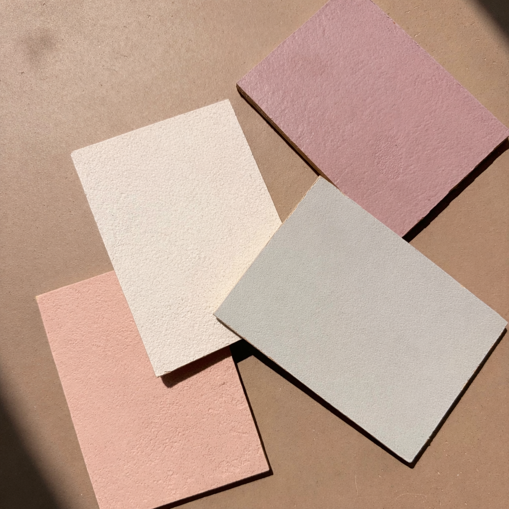 Cemher micro cement finish sample boards showing natural colours and textures used by Surface Revival