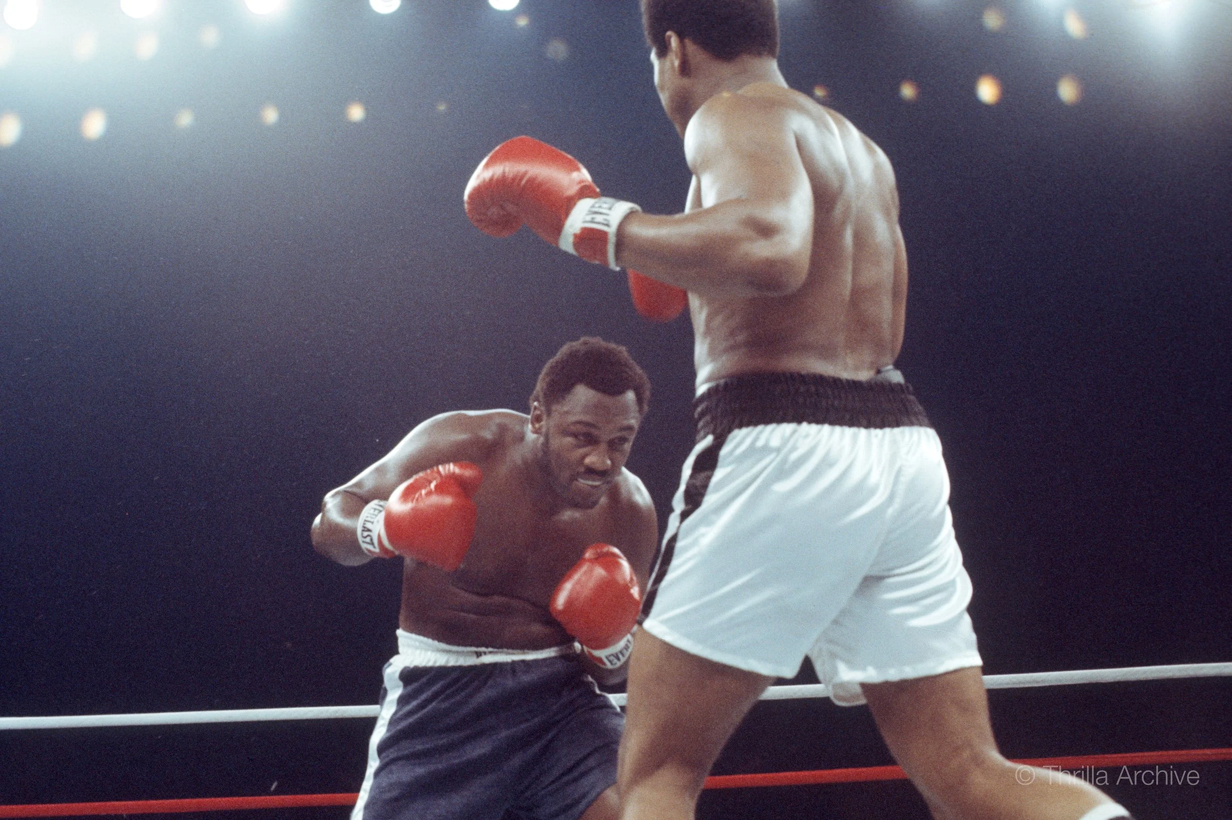 Joe Frazier advances on Muhammad Ali in the early rounds of the Thrilla in Manila, 1975, photographed by Lowell K. Riley
