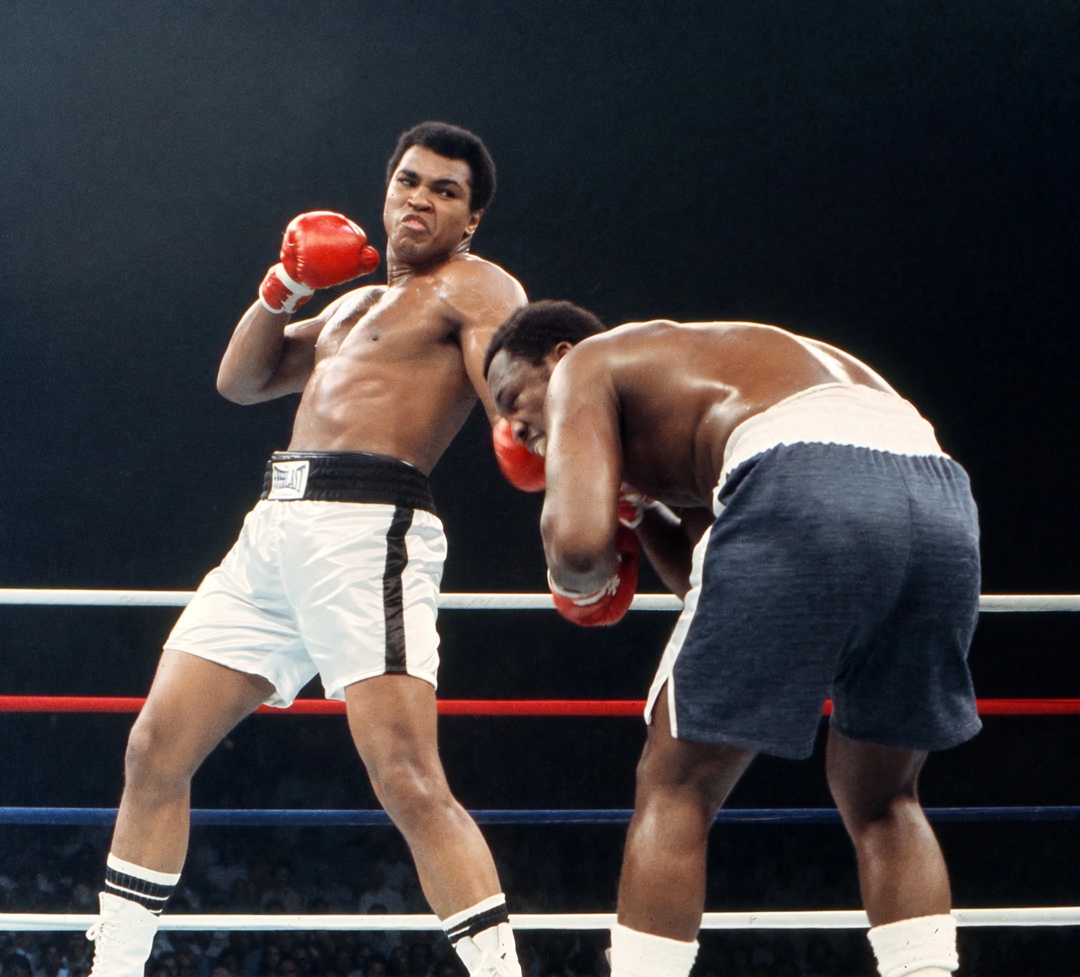 Muhammad Ali lands a left uppercut to Joe Frazier’s jaw as Frazier comes forward during Ali-Frazier III, the Thrilla in Manila.