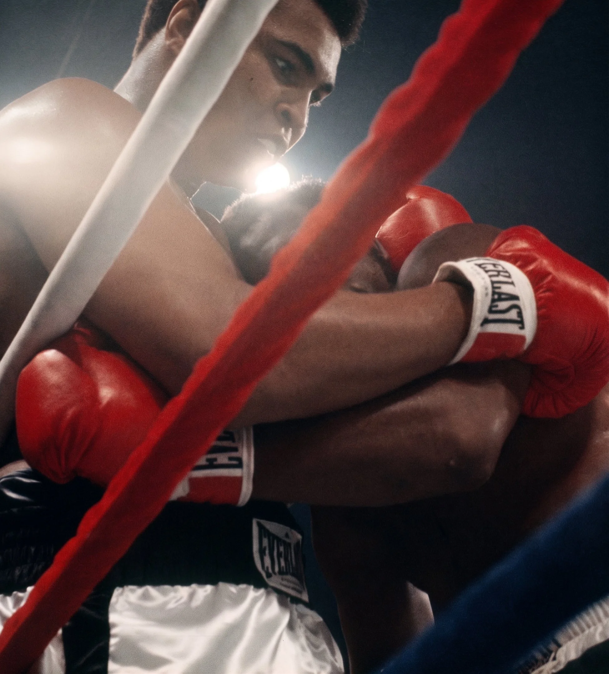 Muhammad Ali and Joe Frazier locked in a clinch during the Thrilla in Manila at the Araneta Coliseum in Quezon City, Philippines, October 1, 1975. Photograph by Lowell K. Riley.