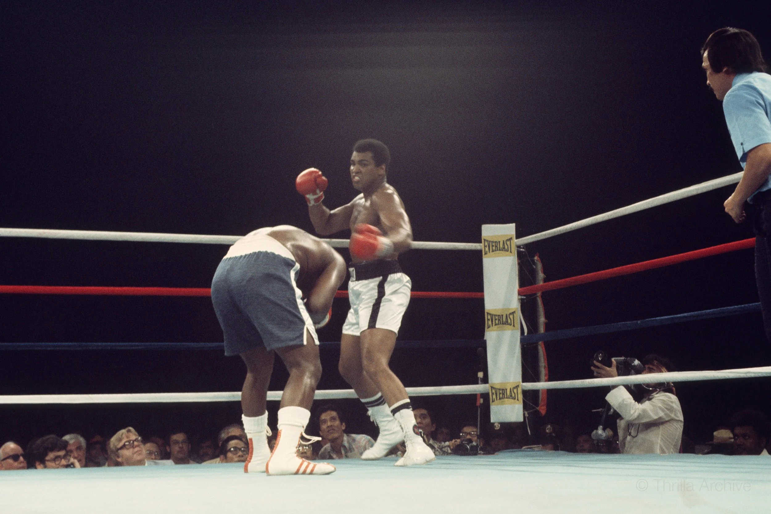 Muhammad Ali counters Joe Frazier with a sharp punch during their third fight, Thrilla in Manila, 1975, photographed by Lowell K. Riley