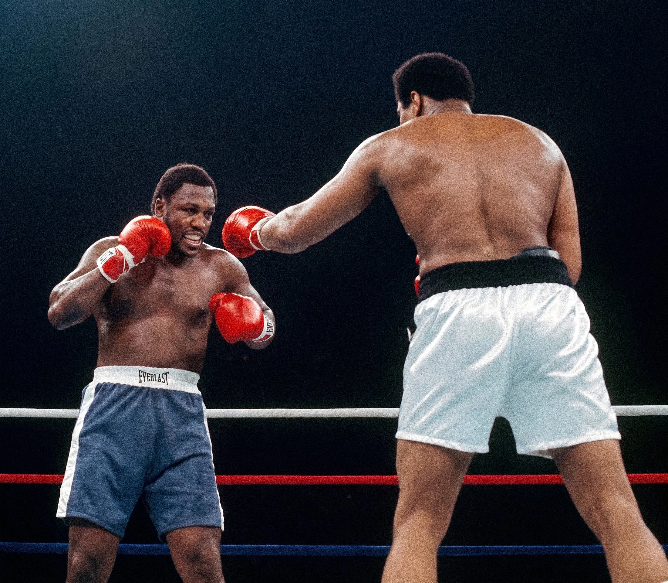 Muhammad Ali probes with his left hand as Joe Frazier measures him up at long range during Ali-Frazier III, the Thrilla in Manila.