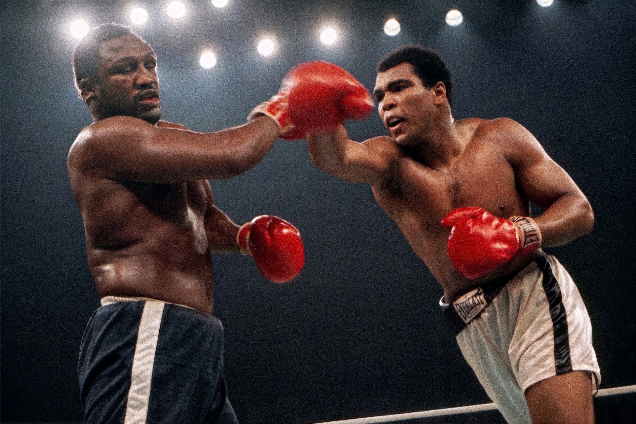 Deep in the punishing championship rounds in Manila, an exhausted Ali launches a desperate right hand into a shattered but unyielding Frazier.