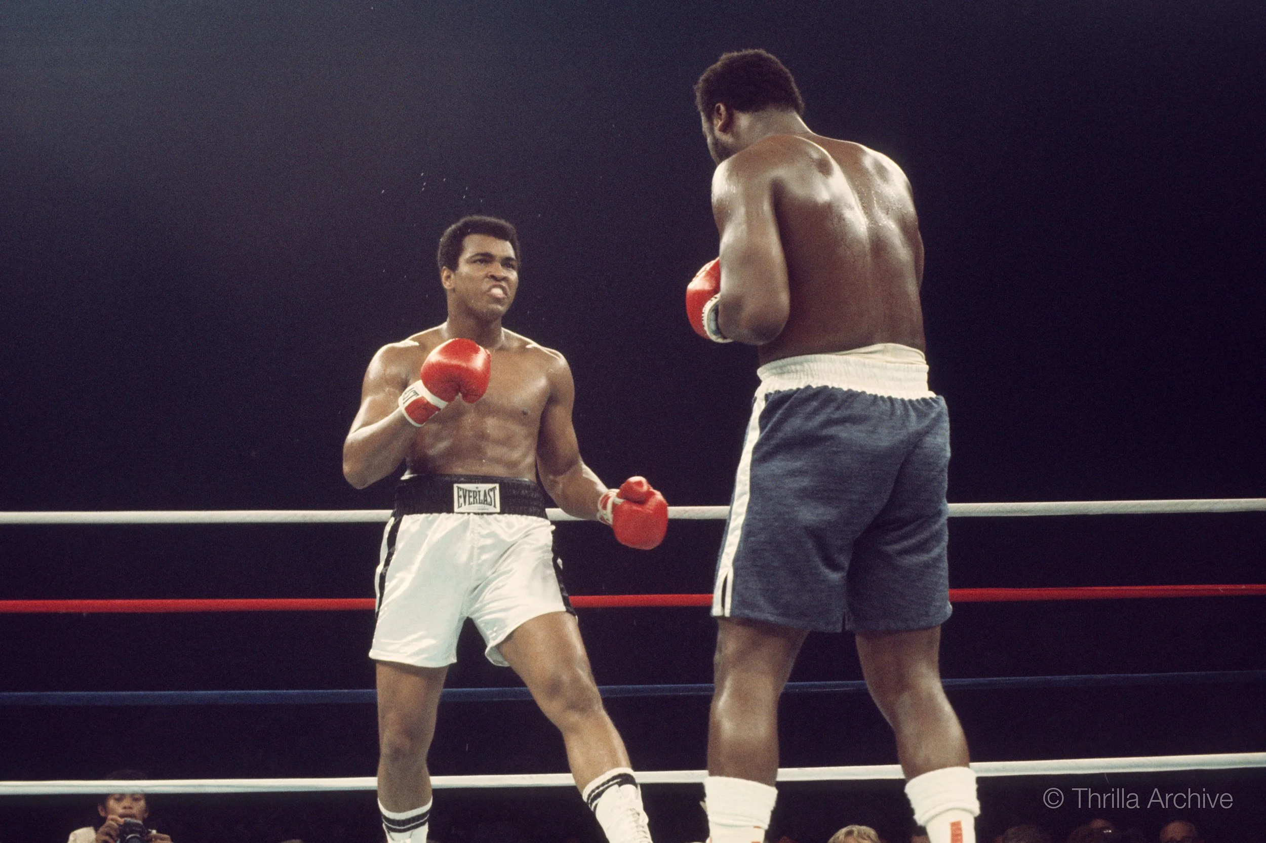 Muhammad Ali and Joe Frazier facing off in the opening moments of the Thrilla in Manila fight, 1975, photographed by Lowell K. Riley