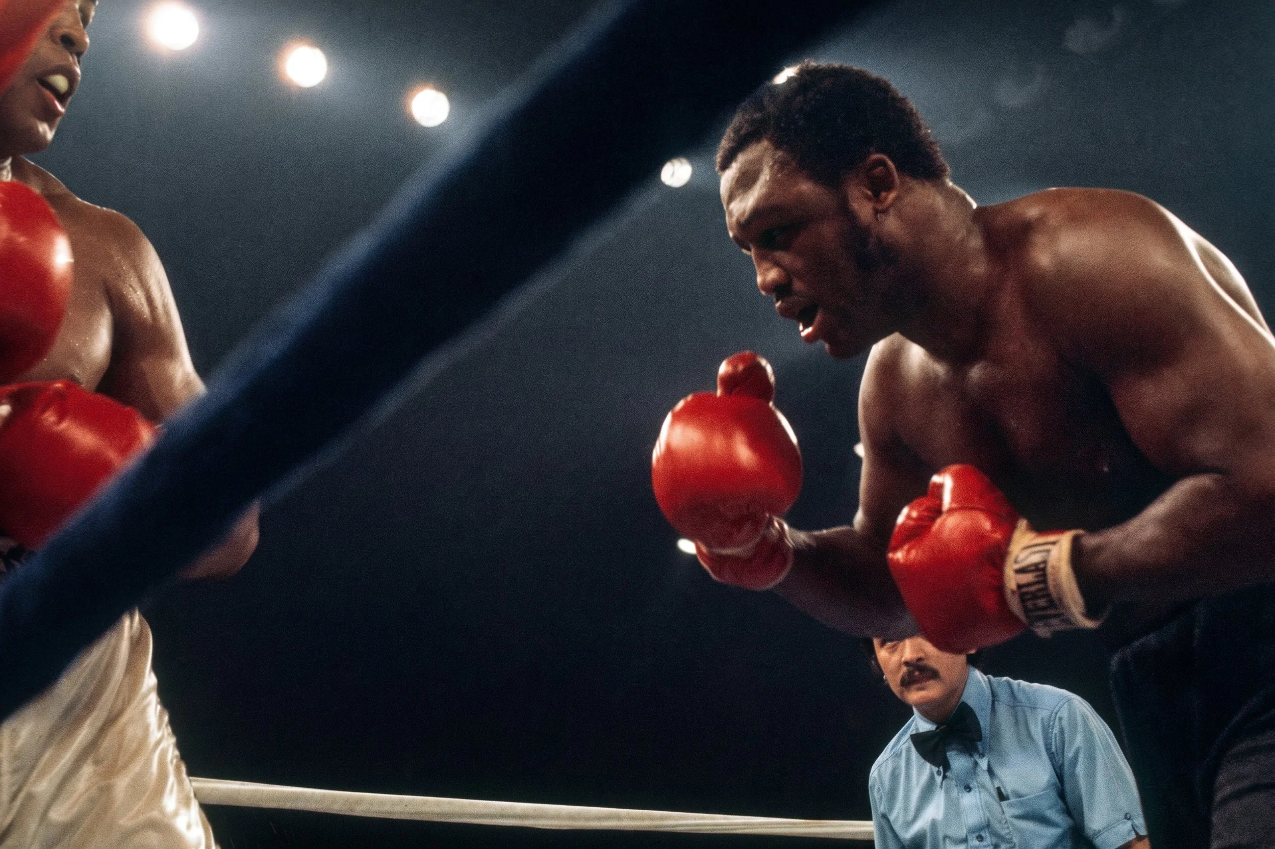 Joe Frazier stalks Muhammad Ali with both gloves at the ready during the later rounds of Ali-Frazier III, the Thrilla in Manila.