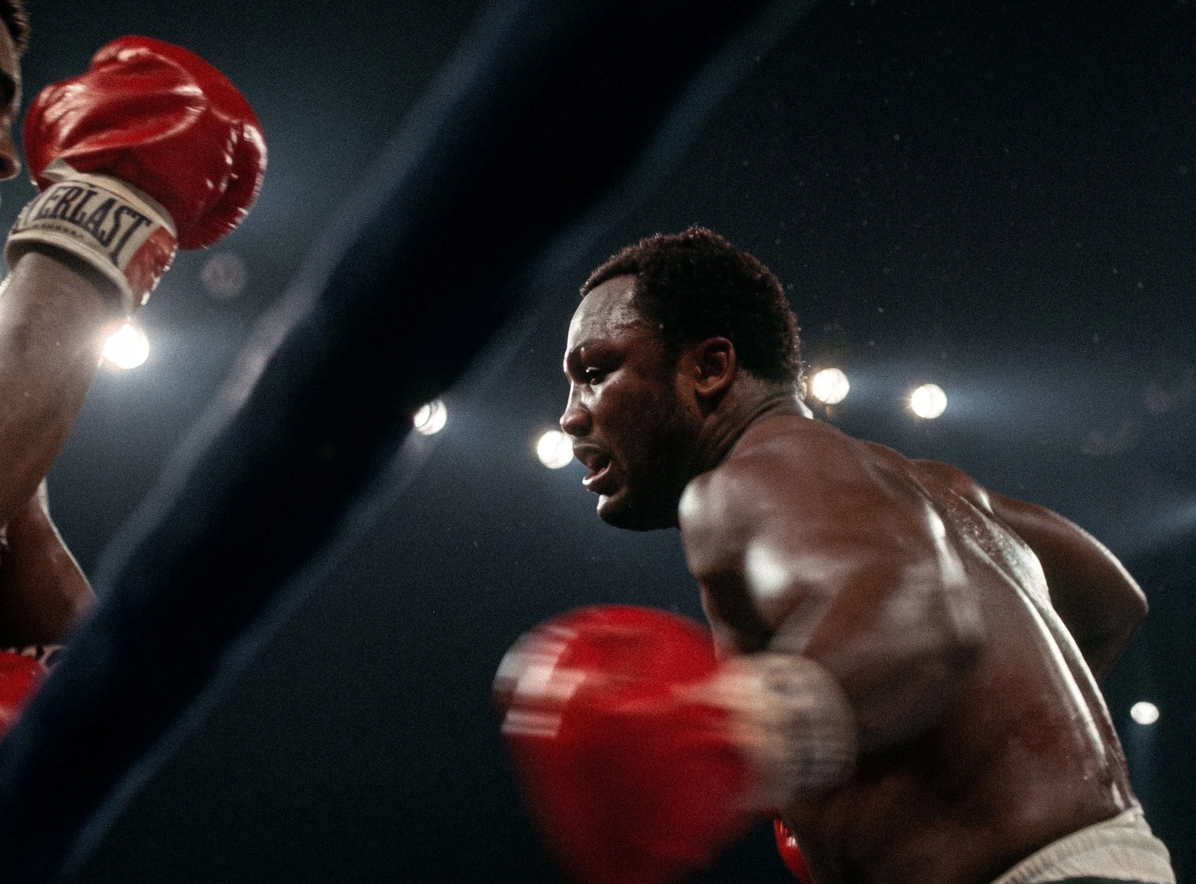Joe Frazier throws his signature left hook at Muhammad Ali from close range during Ali-Frazier III, the Thrilla in Manila.