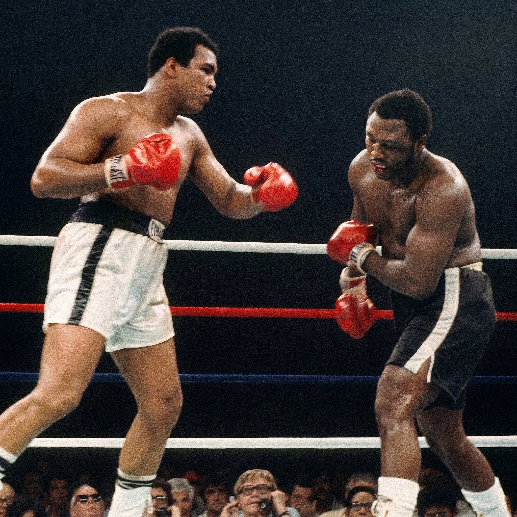 Muhammad Ali lands a left hand on Joe Frazier, whose lower lip is bloodied, during the late rounds of Ali-Frazier III.