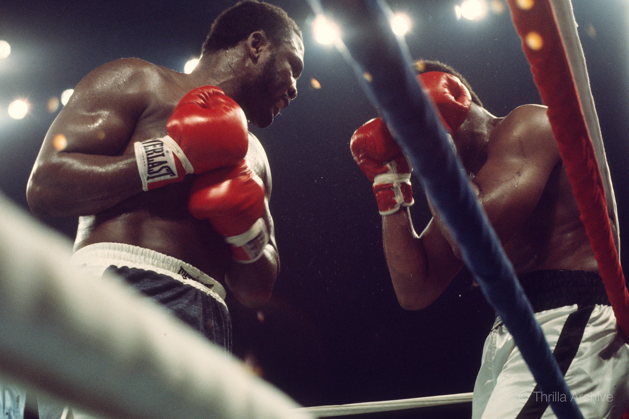 Joe Frazier lands a left hand on Muhammad Ali against the ropes during the Thrilla in Manila, 1975 boxing match