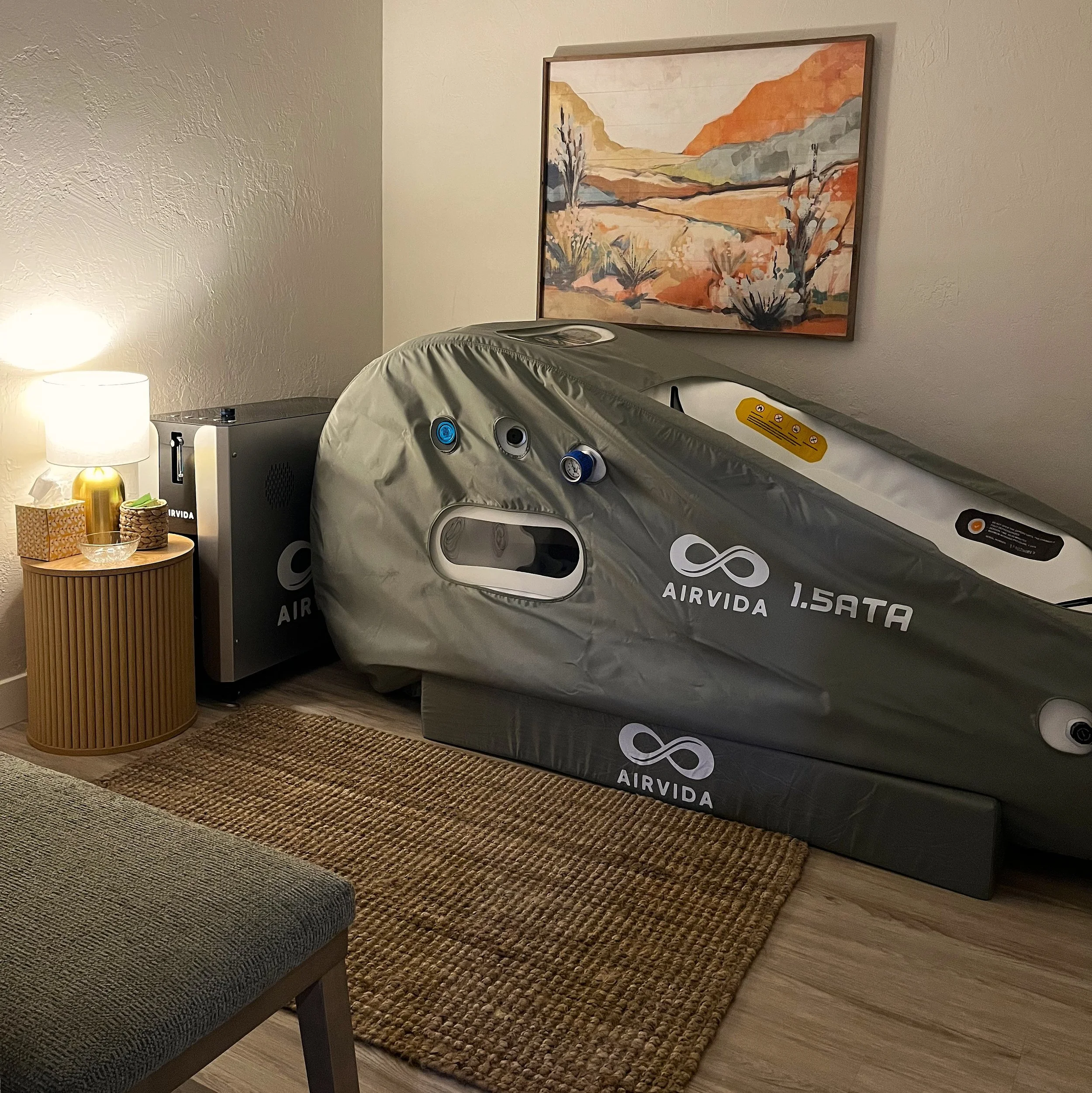 Private Oxygen Suite featuring a hyperbaric oxygen therapy (HBOT) chamber at Stillpoint Wellness in North Phoenix, Arizona, offering a relaxing wellness experience.