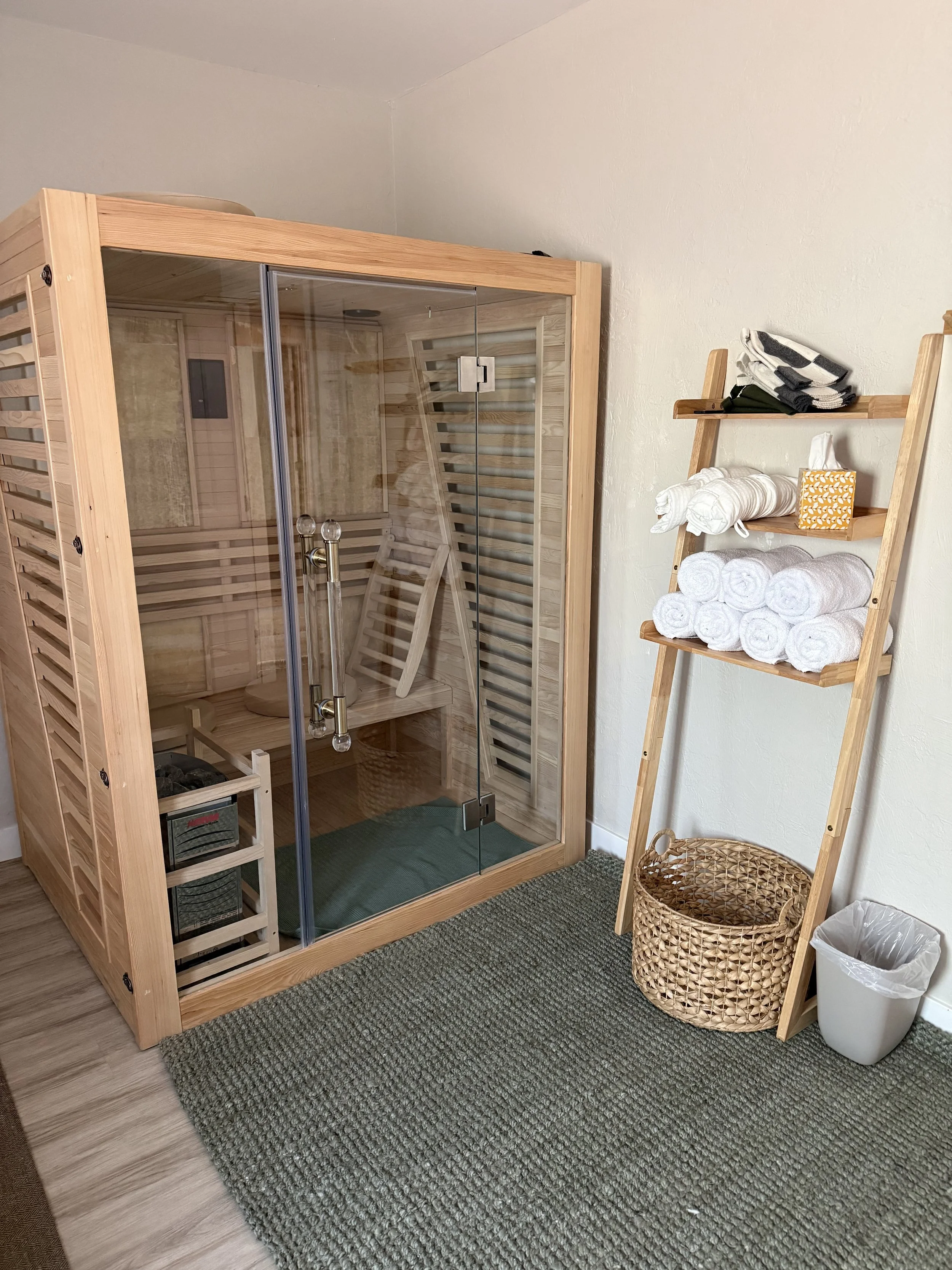 Traditional steam sauna in the private Contrast Suite at Stillpoint Wellness in North Phoenix, Arizona, offering a relaxing heat therapy experience.