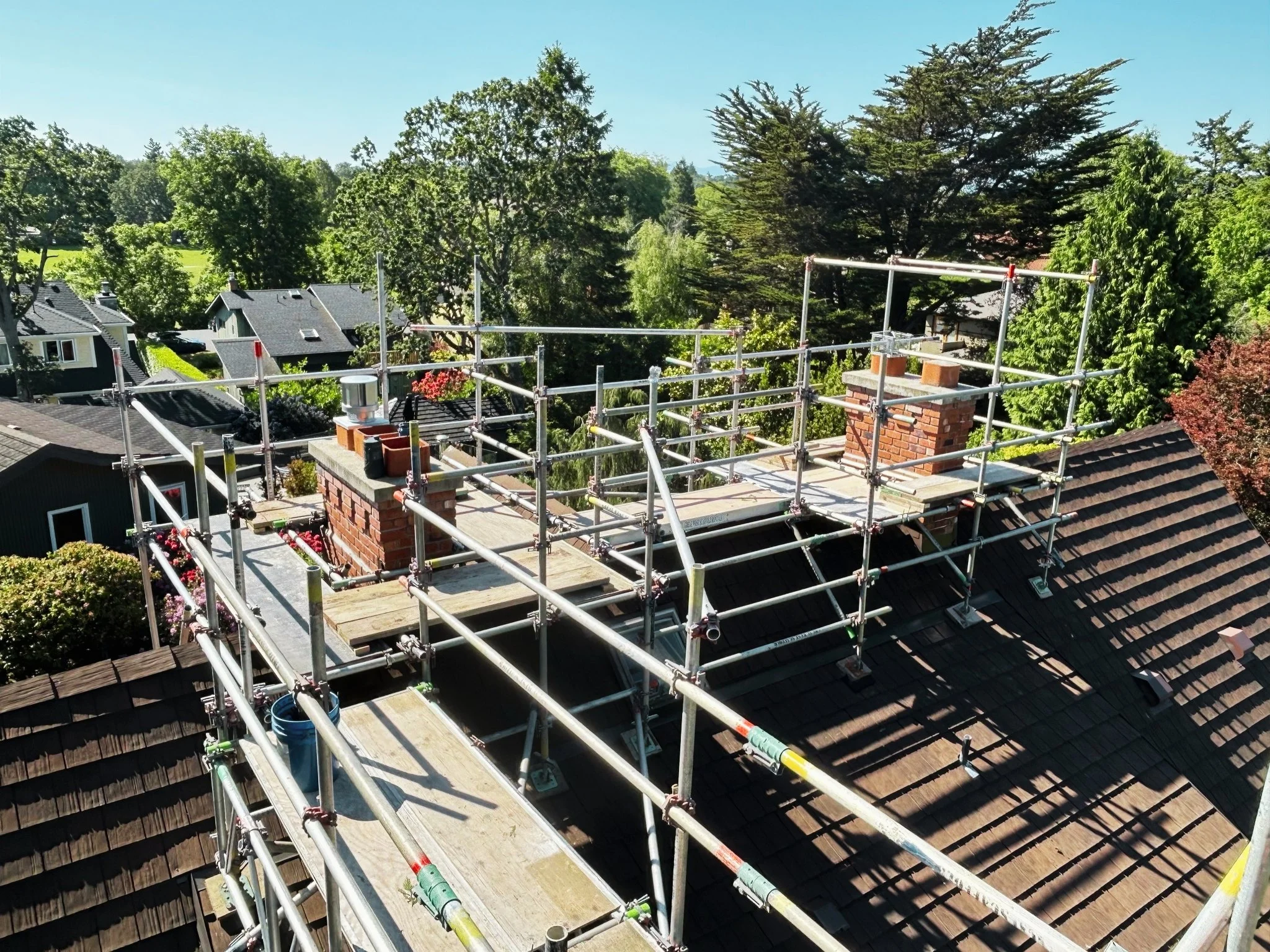 Custom scaffolding around a residential chimney for masonry repair in Victoria, BC