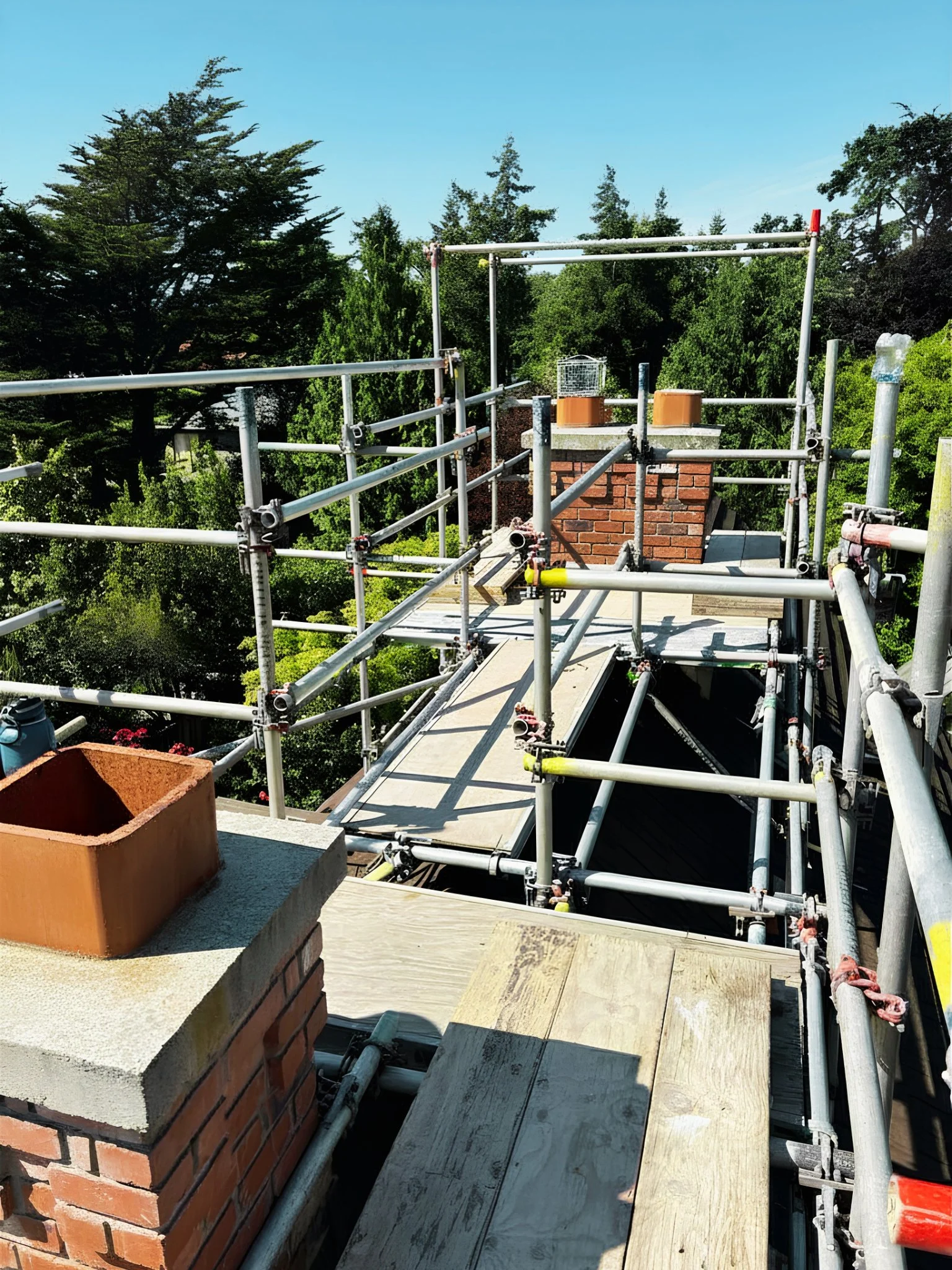 Safe rooftop scaffolding platform built by Summit Scaffolding Servies Ltd for high-access residential maintenance in Victoria, BC