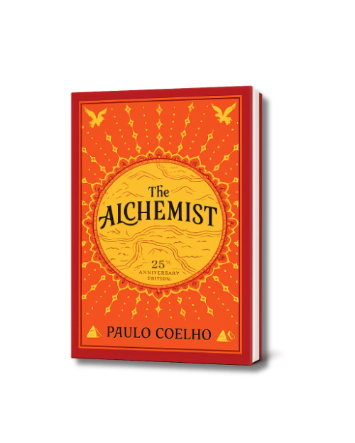 Book titled "The Alchemist" by Paulo Coelho, celebrating the 25th anniversary edition with a bright orange and yellow cover featuring a sun motif