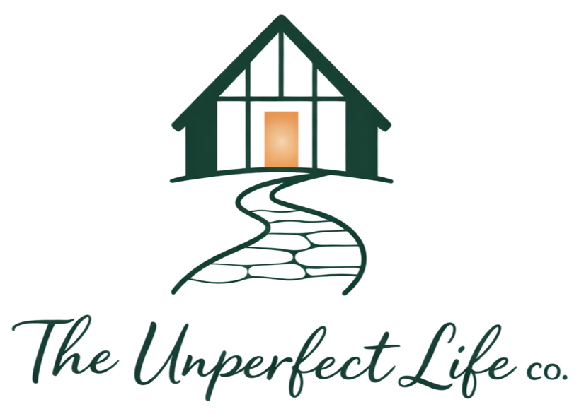 Logo of The Unperfect Life Co. featuring a stylized house with a pathway leading to the door.