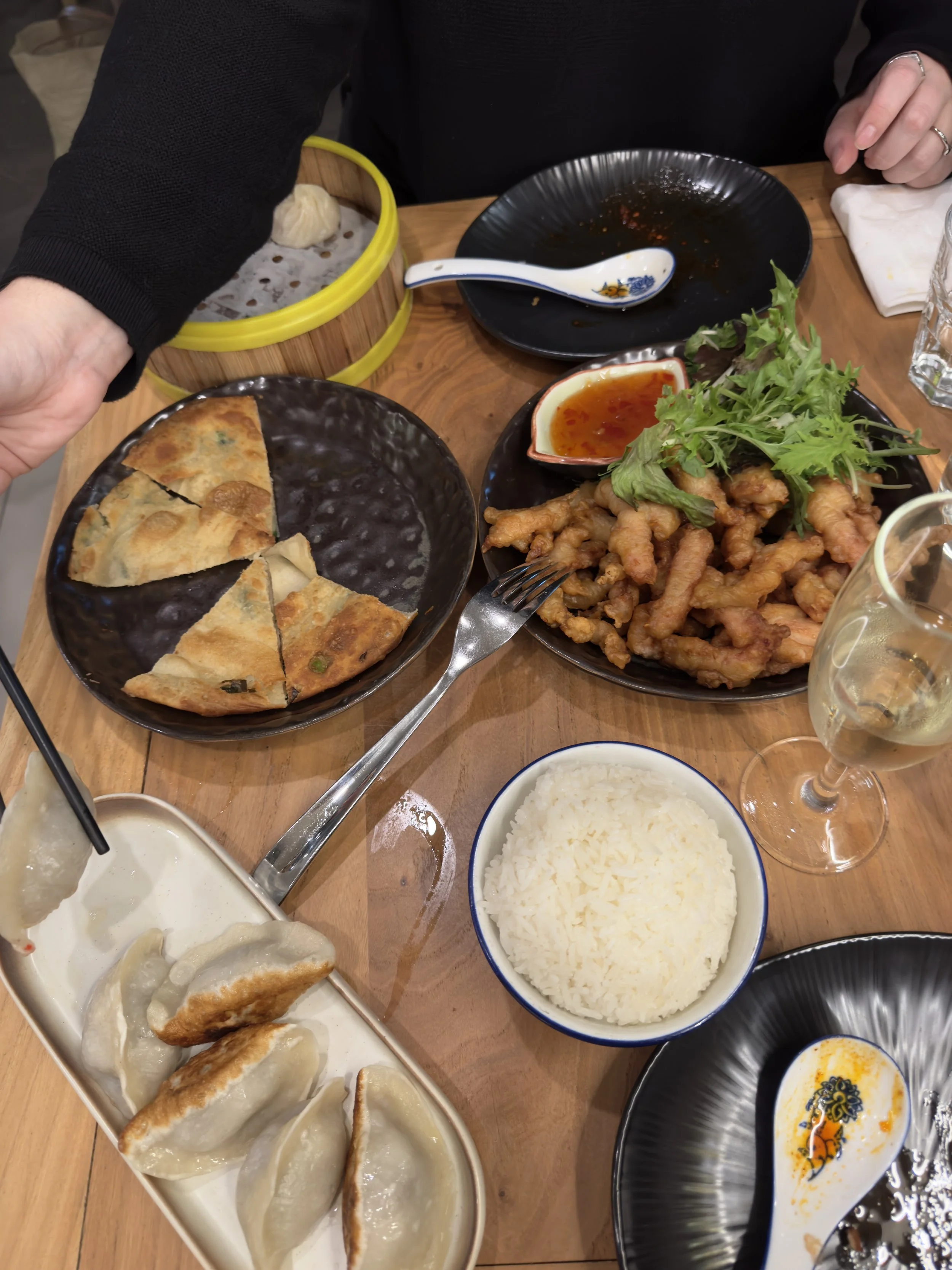 a table of food at Dear Deer Dumpling