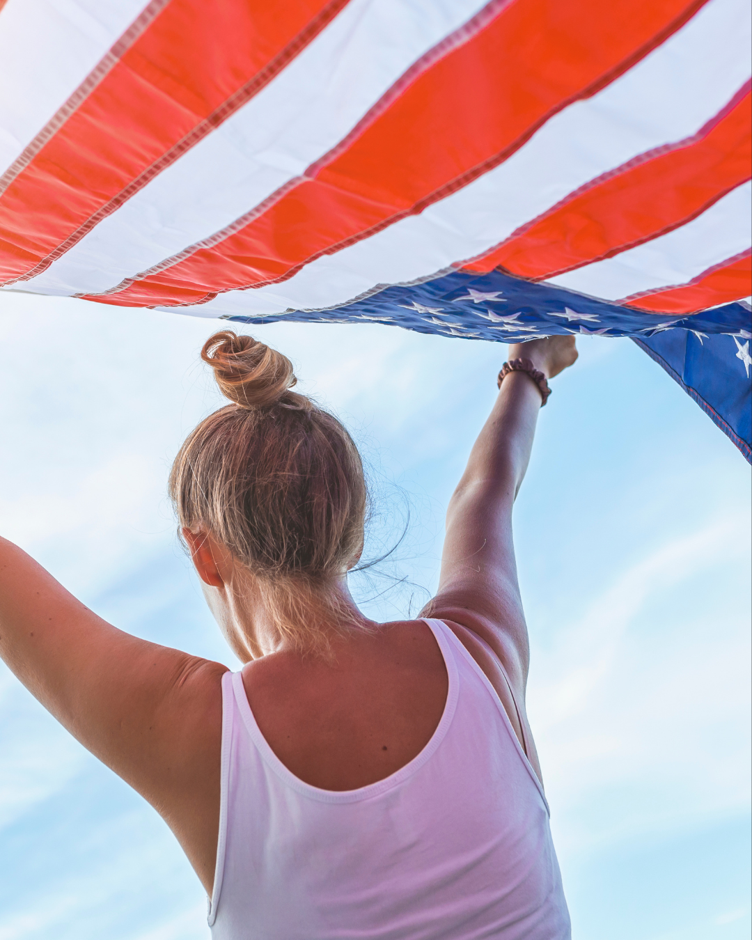 Young Woman Holding American Flag