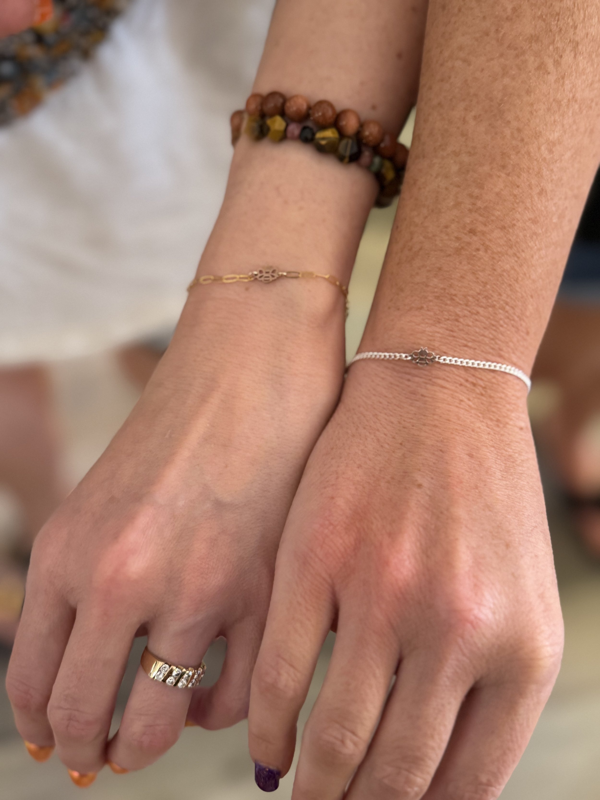 Matching permanent bracelets on two wrists, Lago Vista TX