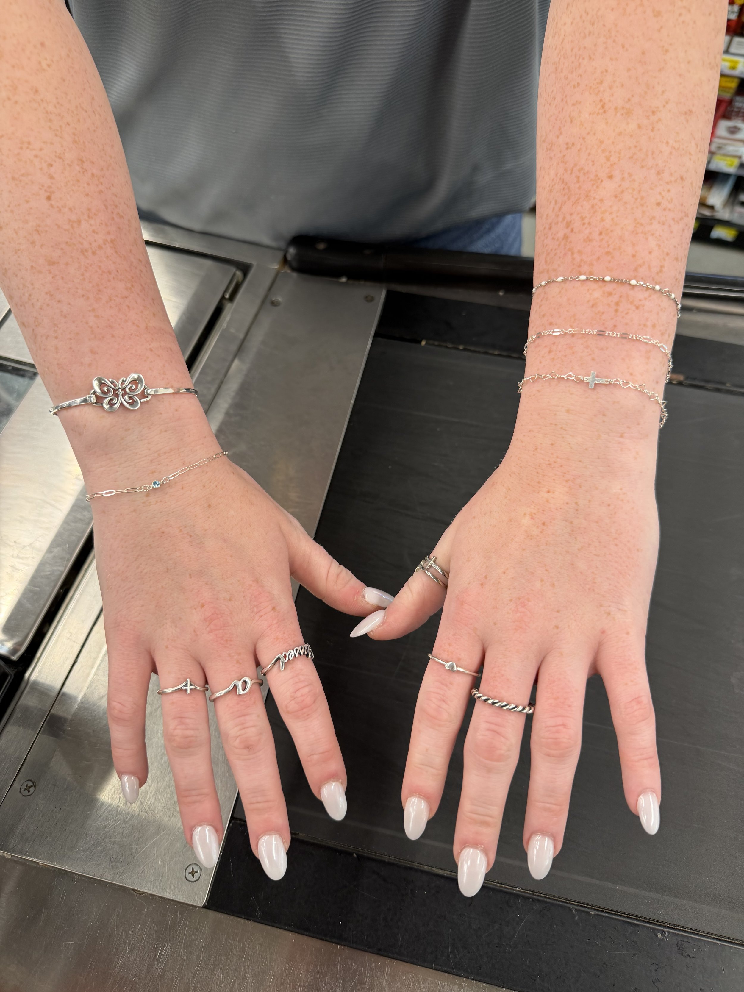 Stacked permanent bracelets on both wrists, Lago Vista TX