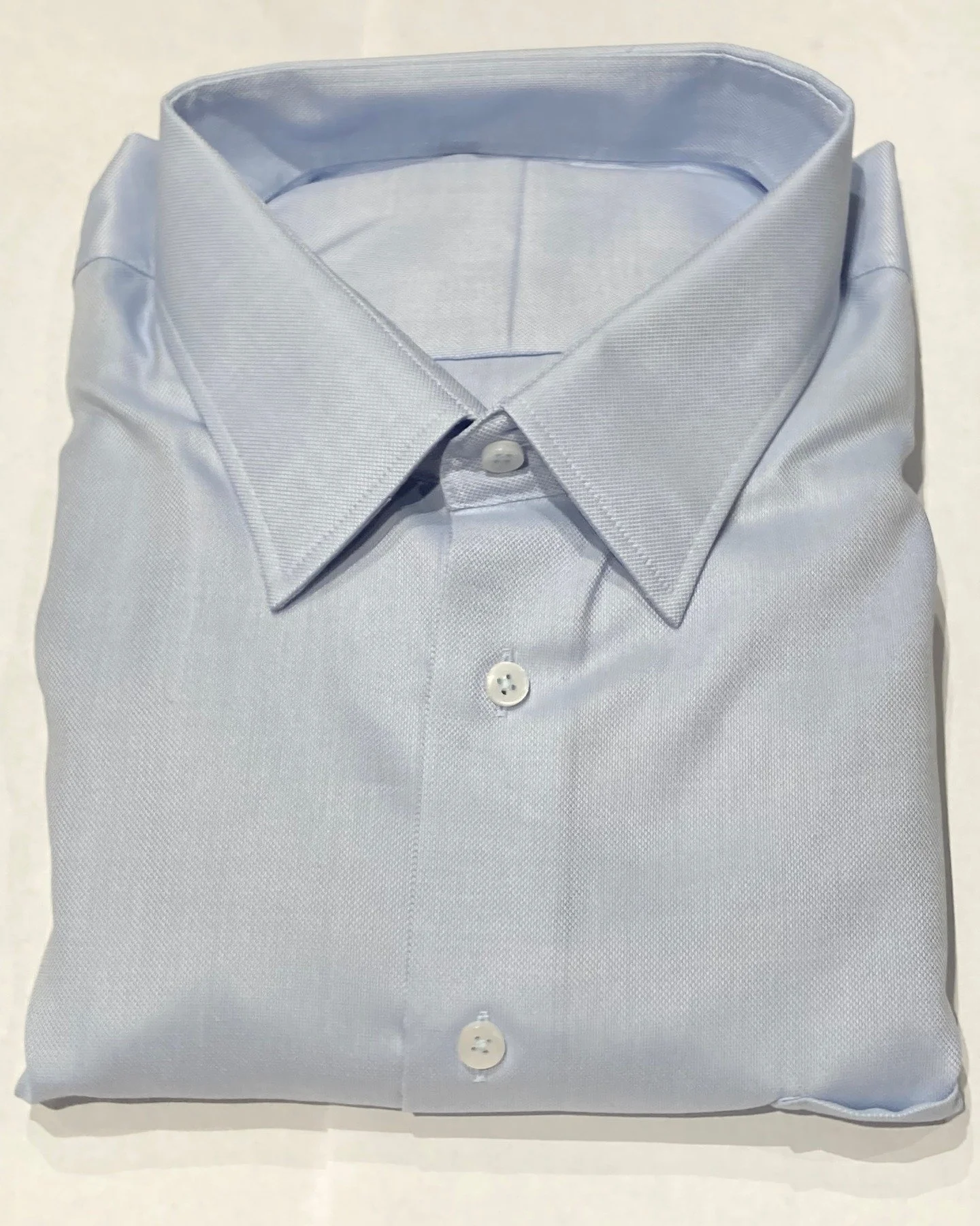 One thing that sets Collarreplacement.com apart is that you can get an extra collar and cuffs with each new made to measure shirt. This guarantees access to the original fabric when it's time to replace the cuffs. This is light blue dobby shirt with 