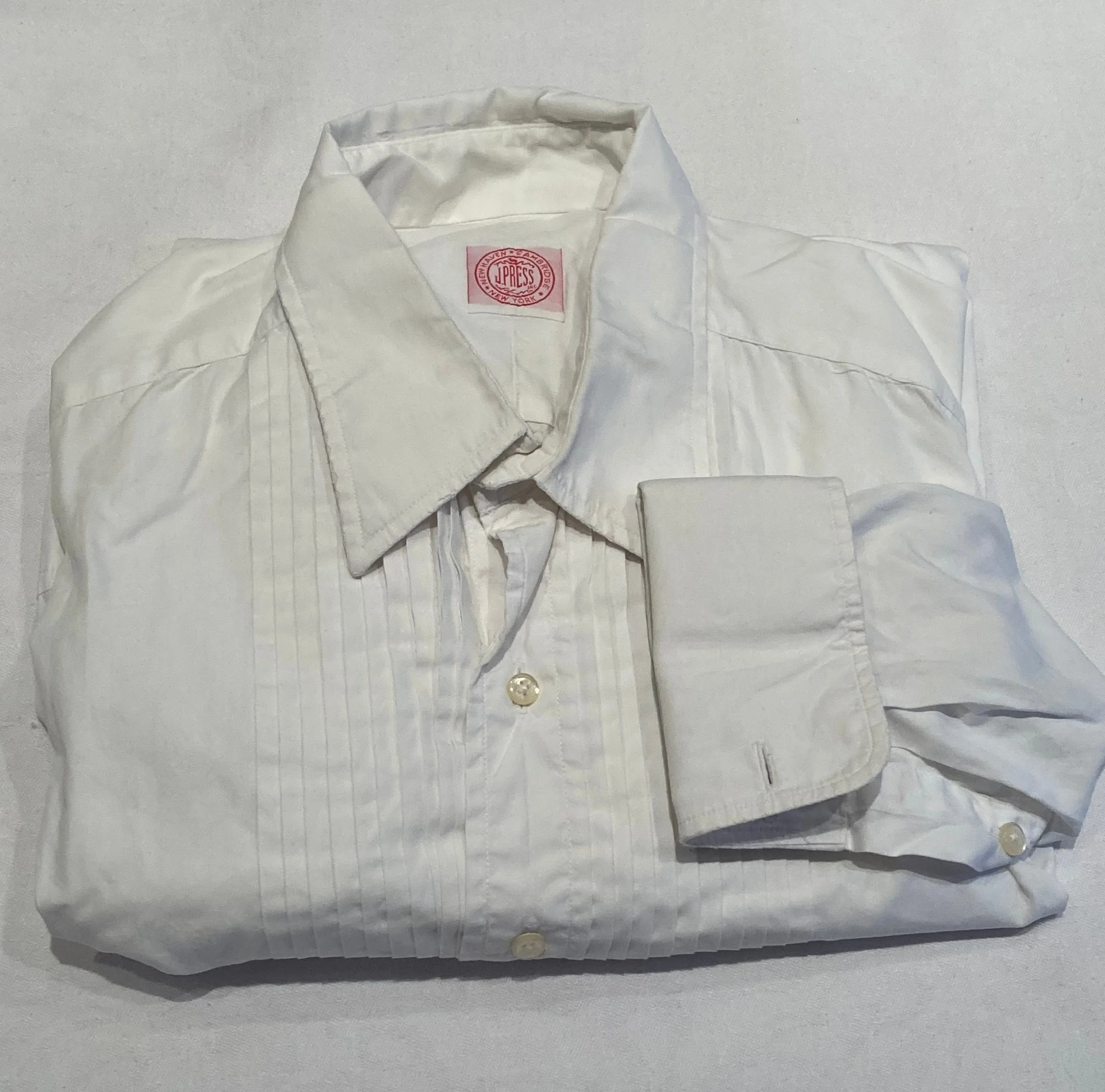 Pleated tuxedo shirt with frayed collar that is too small