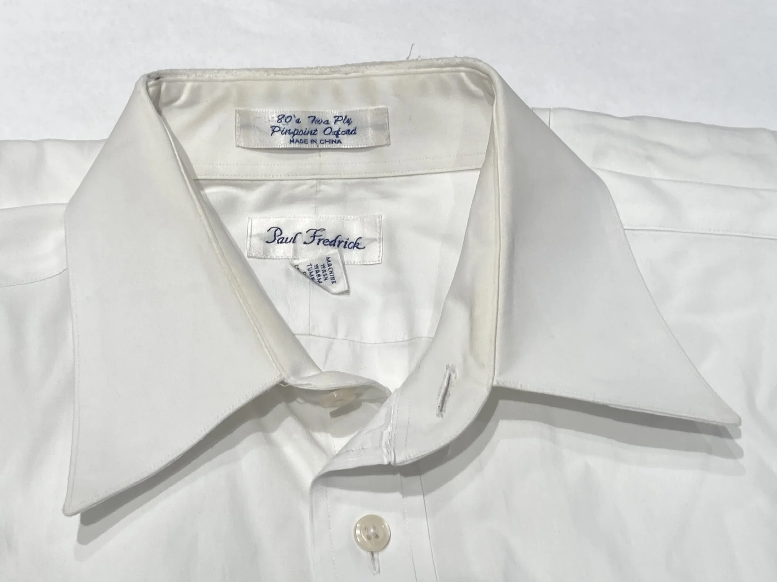 Frayed and de-threaded shirt collar