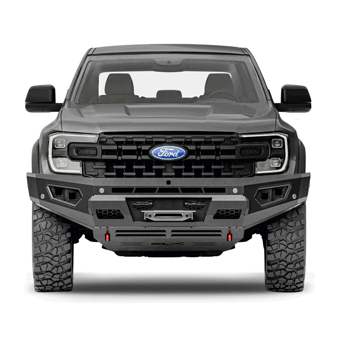 Front view of a black Ford pickup truck with rugged tires, black grille, and aggressive front bumper.