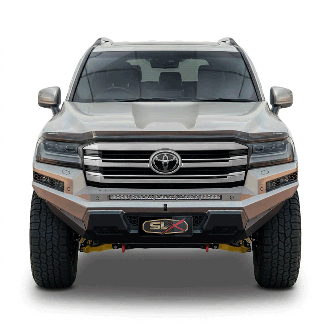 Front view of a modern Toyota SUV with a custom geometric paint job, black grille, large tires, and a SLX badge on the front bumper.