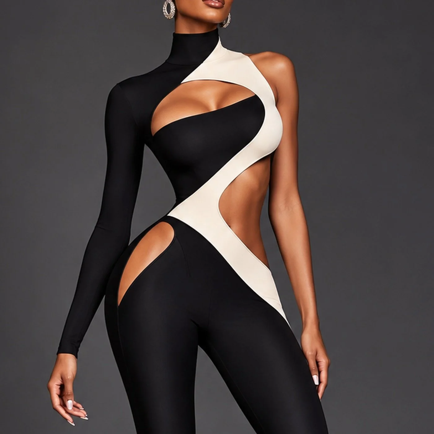 Black-and-ivory cutout catsuit with graphic negative-space detailing from the GIRLTALK ATELIER October 2026 fashion edit