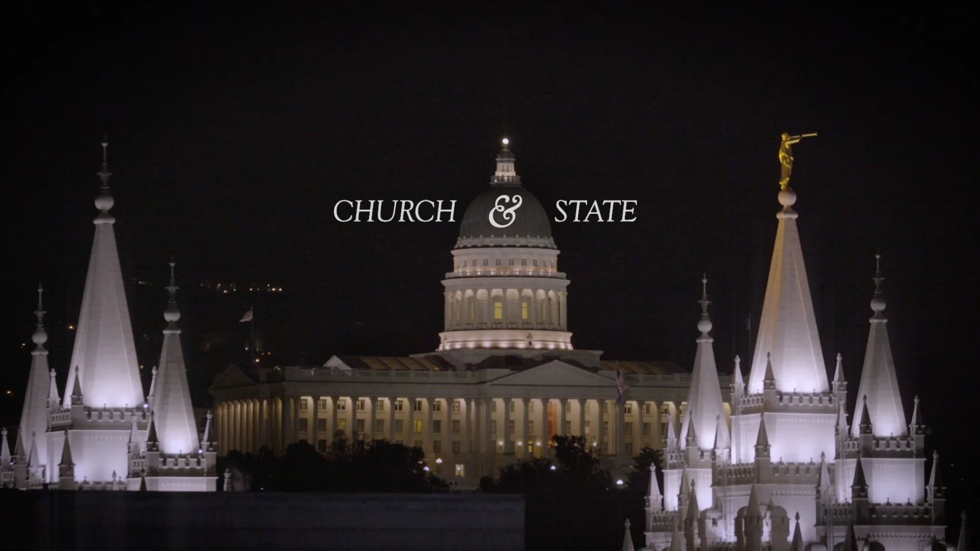 Night view of the Utah State Capitol building with illuminated white spires and a dome, and the text 'Church & State' superimposed over the scene.