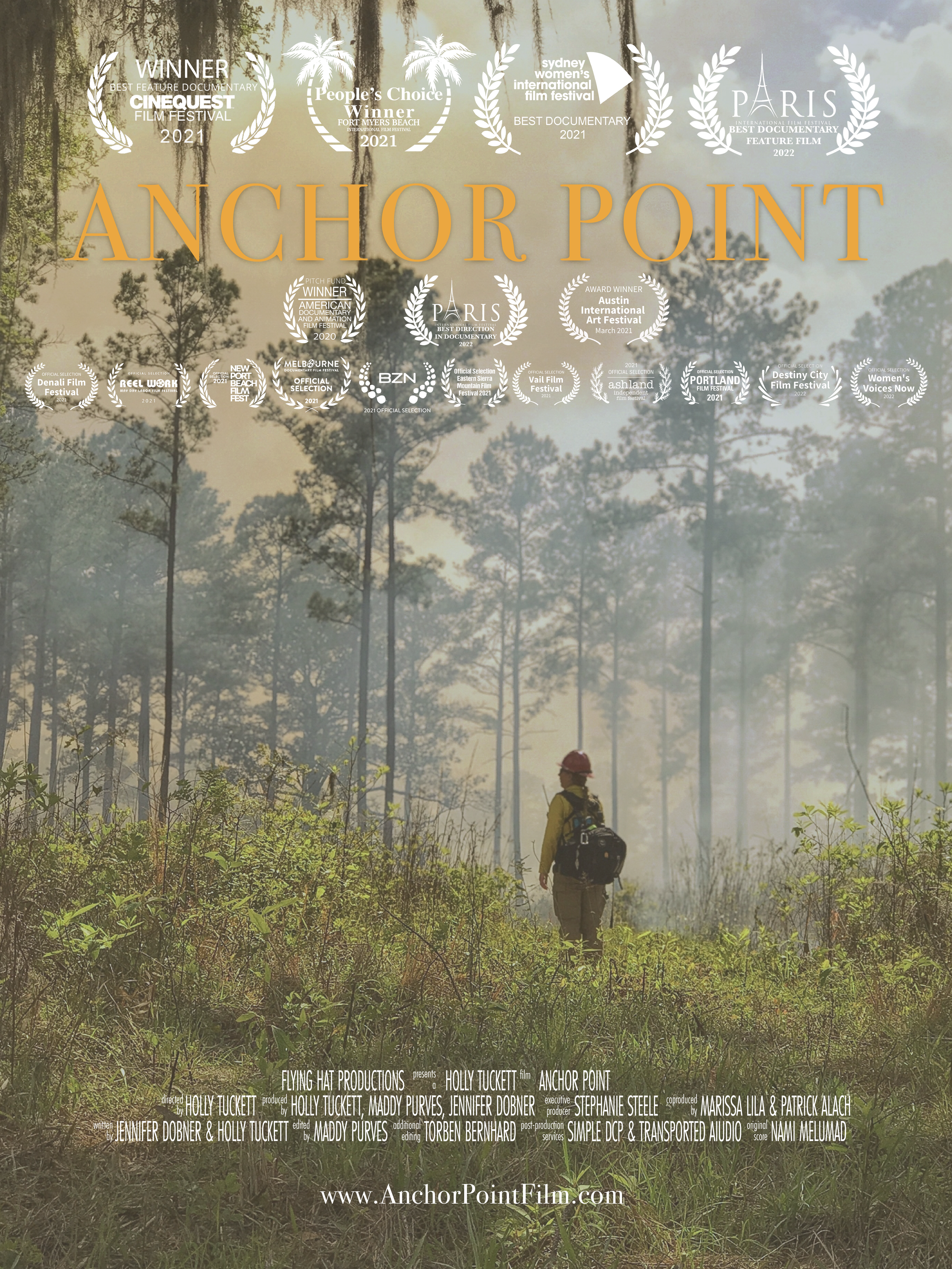 Movie poster for 'Anchor Point' featuring a person in a yellow shirt and red helmet walking through a forest with smoke or fog, with trees in the background and awards at the top of the poster.