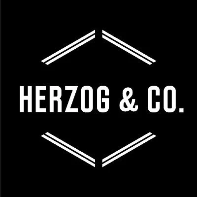 Black background with white geometric lines and the text "HERZOG & CO." in the center.