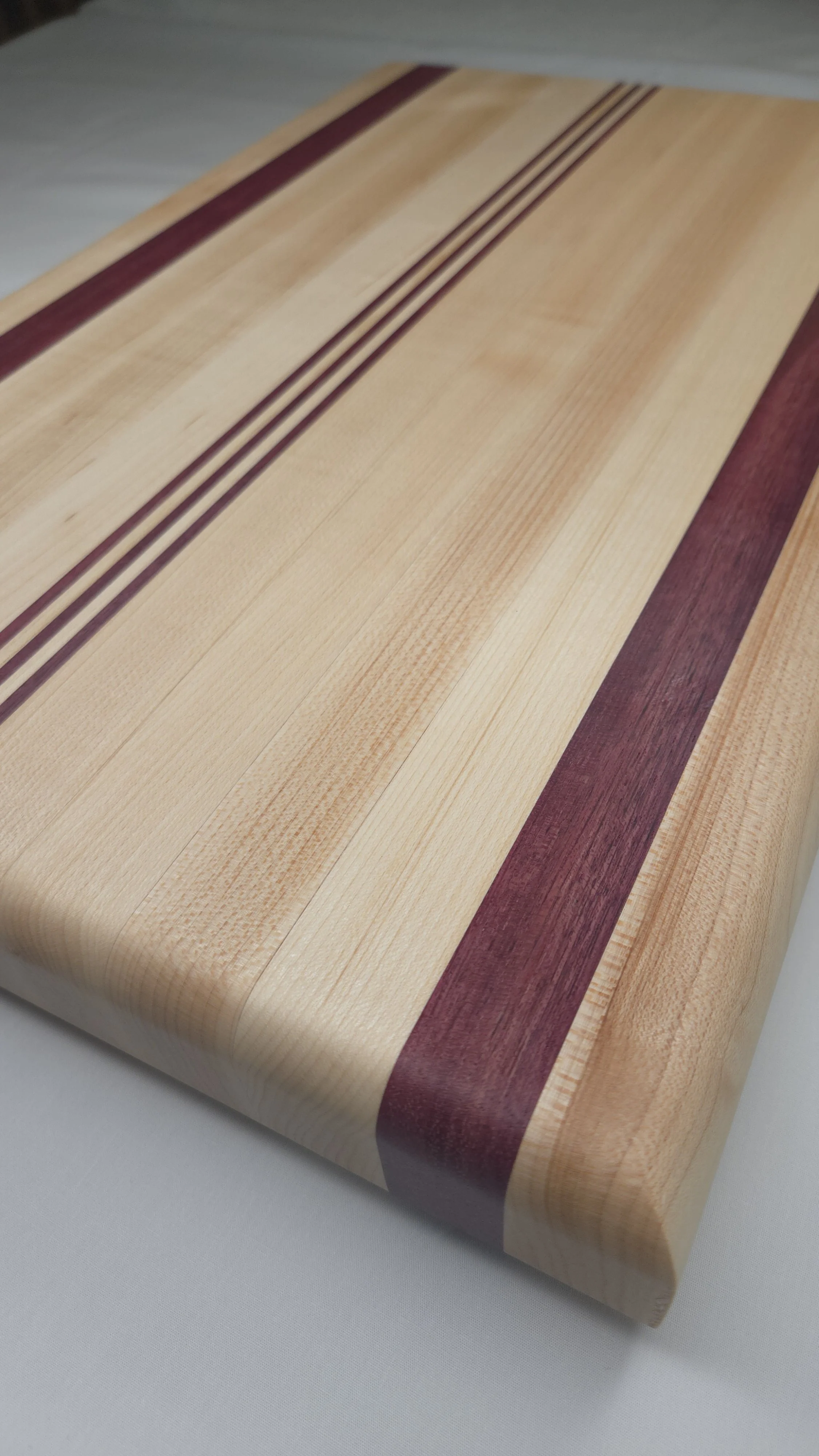 Edge grain Maple and Purple Heart cutting board