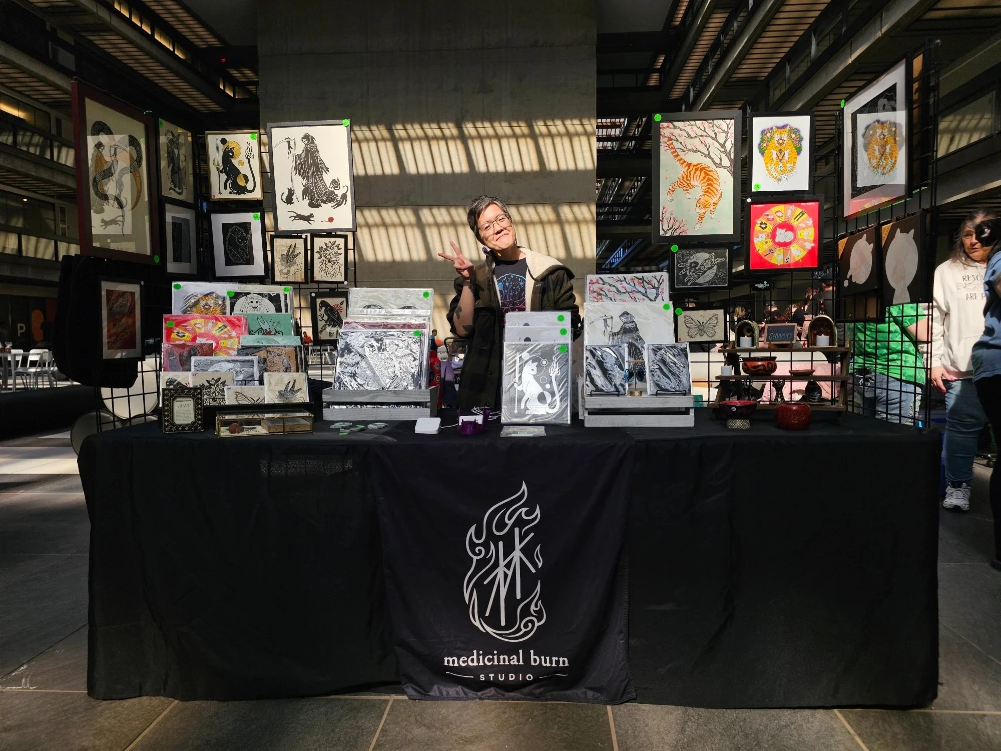 Medicinal Burn Studio booth at a pop-up market at BellWorks