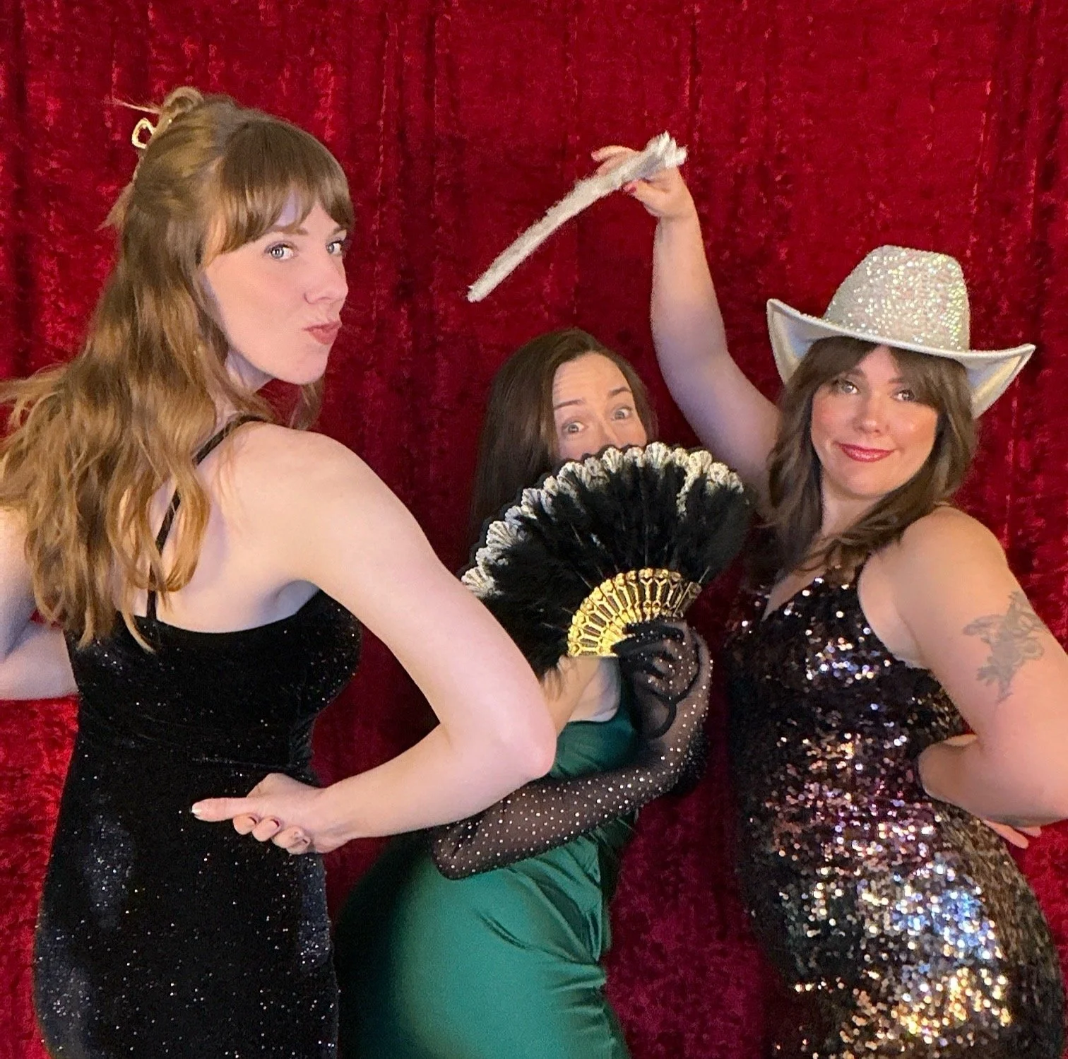 wedding guests posing with props at a Nashville wedding photo booth, candid guest experience with premium backdrop and instant sharing