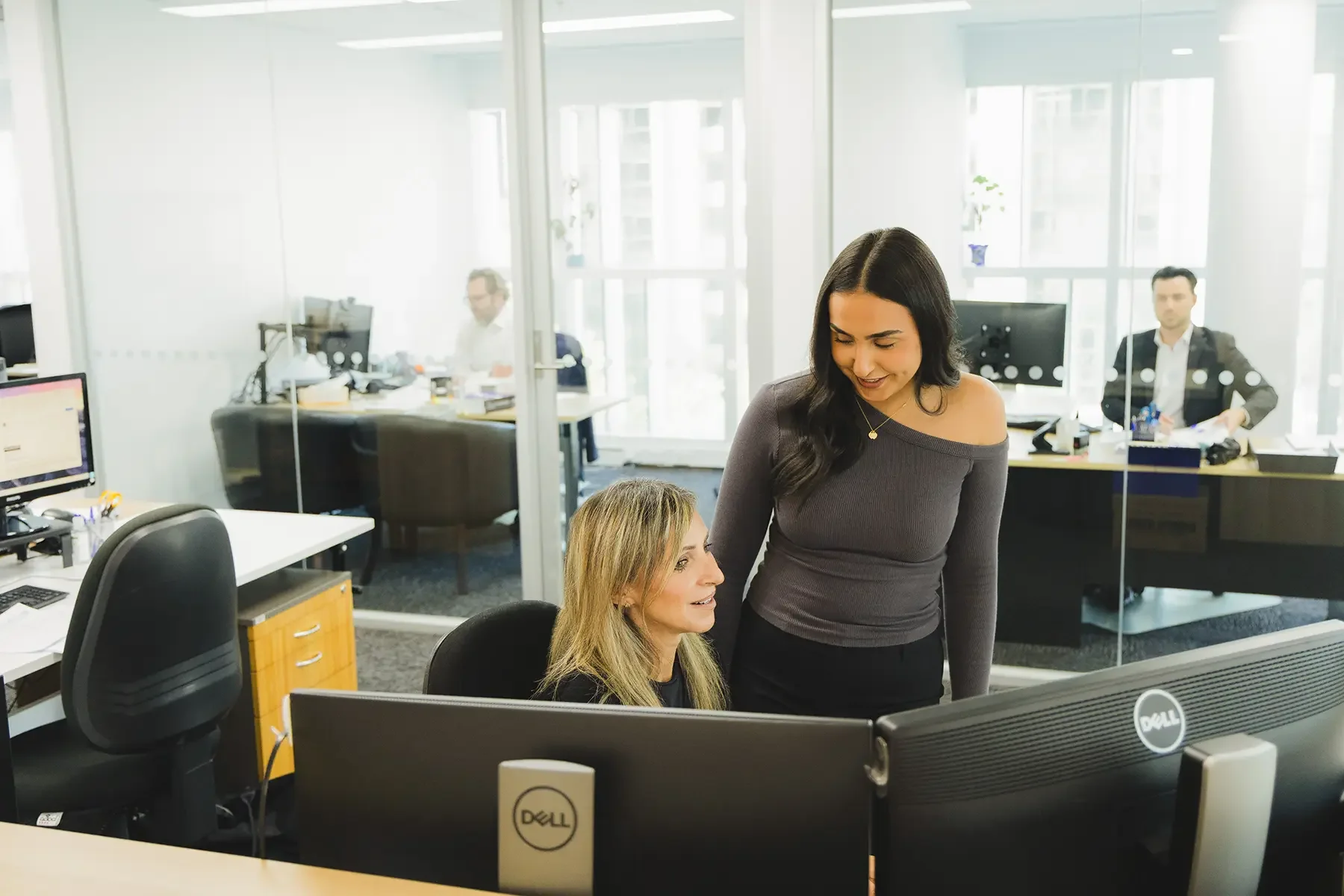Sia and Chantelle working in the office.