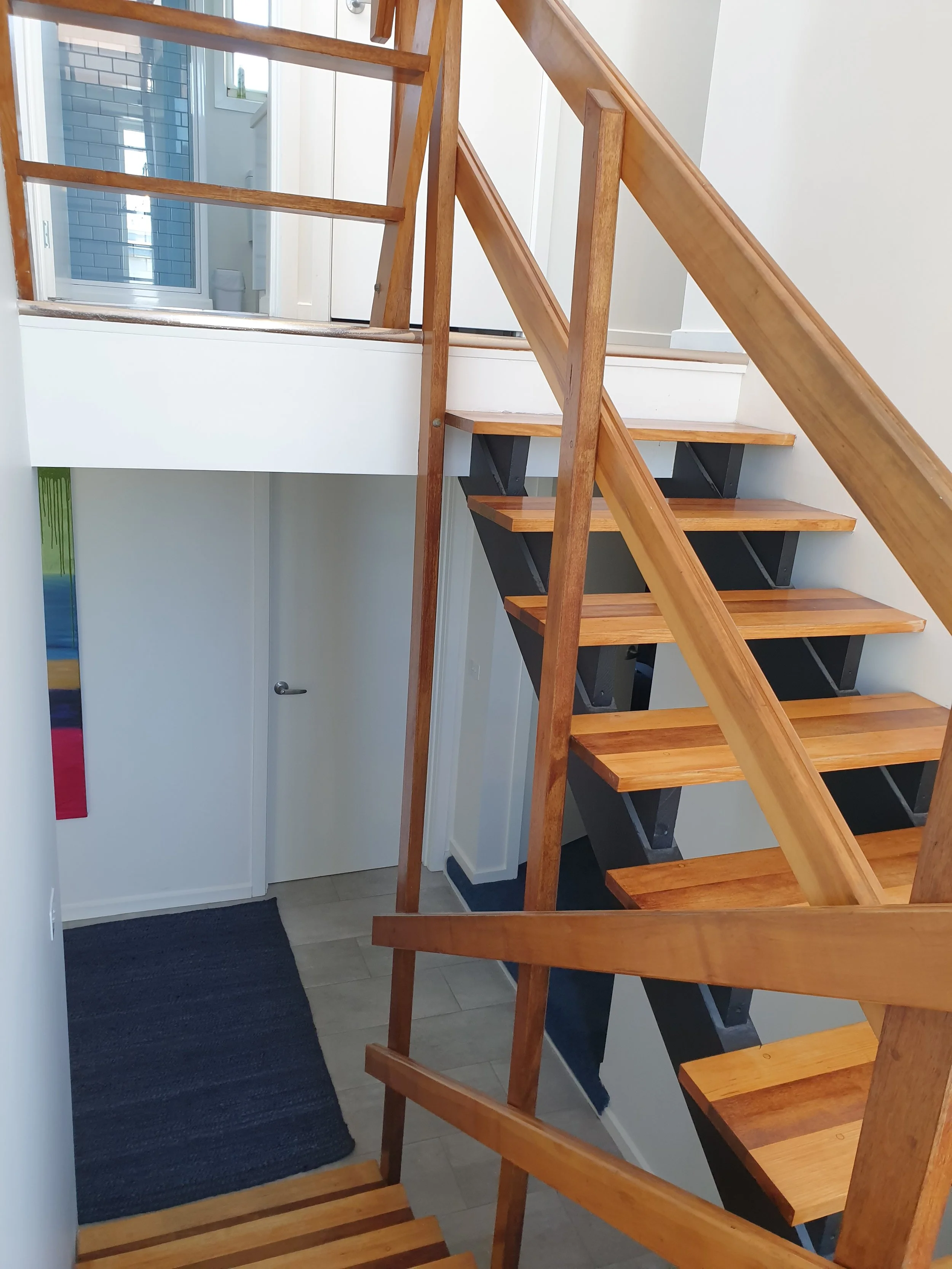 The stairwell that runs from the ground floor to the first floor. 