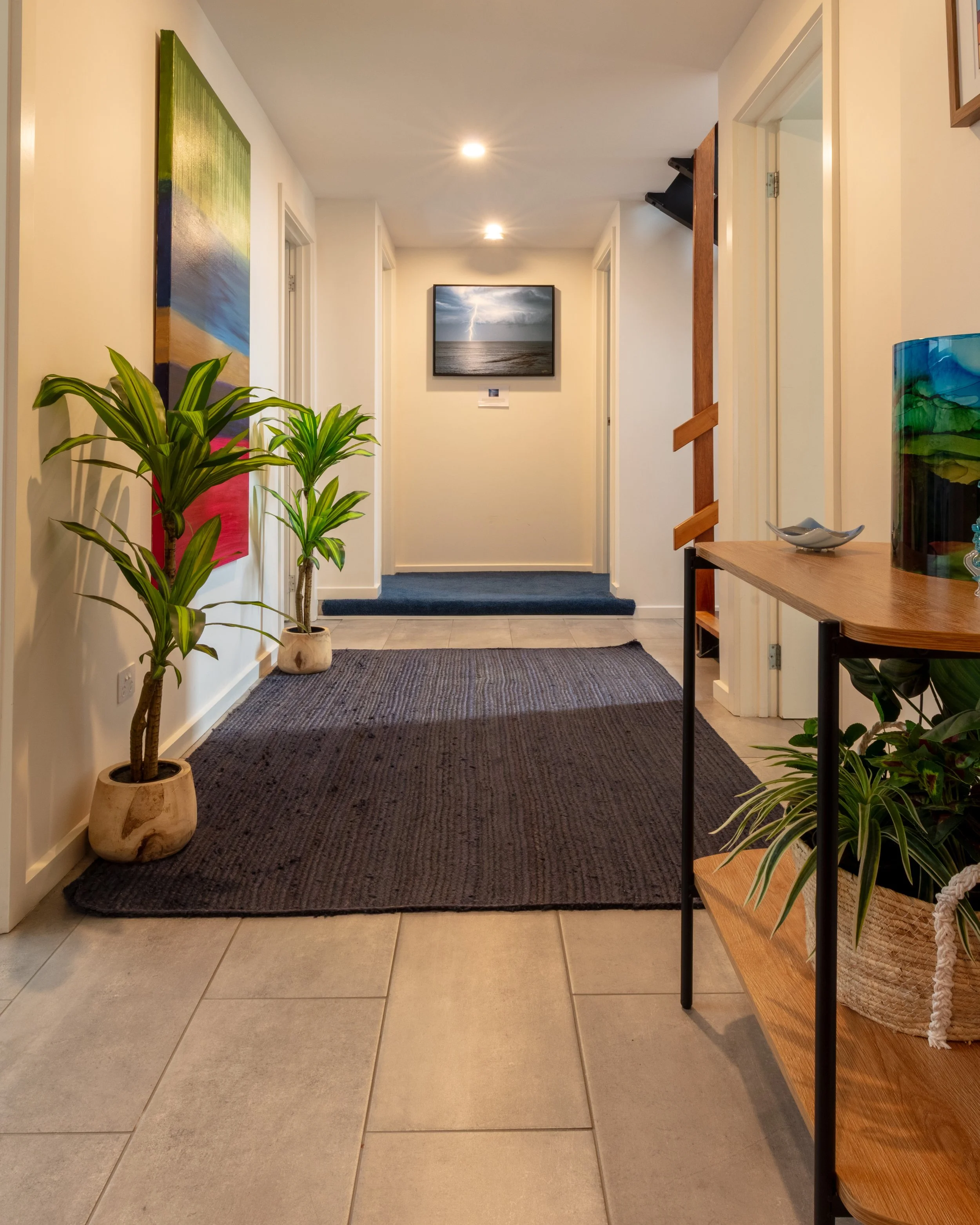 A hallway from the bar/tv room to the downstairs bedrooms