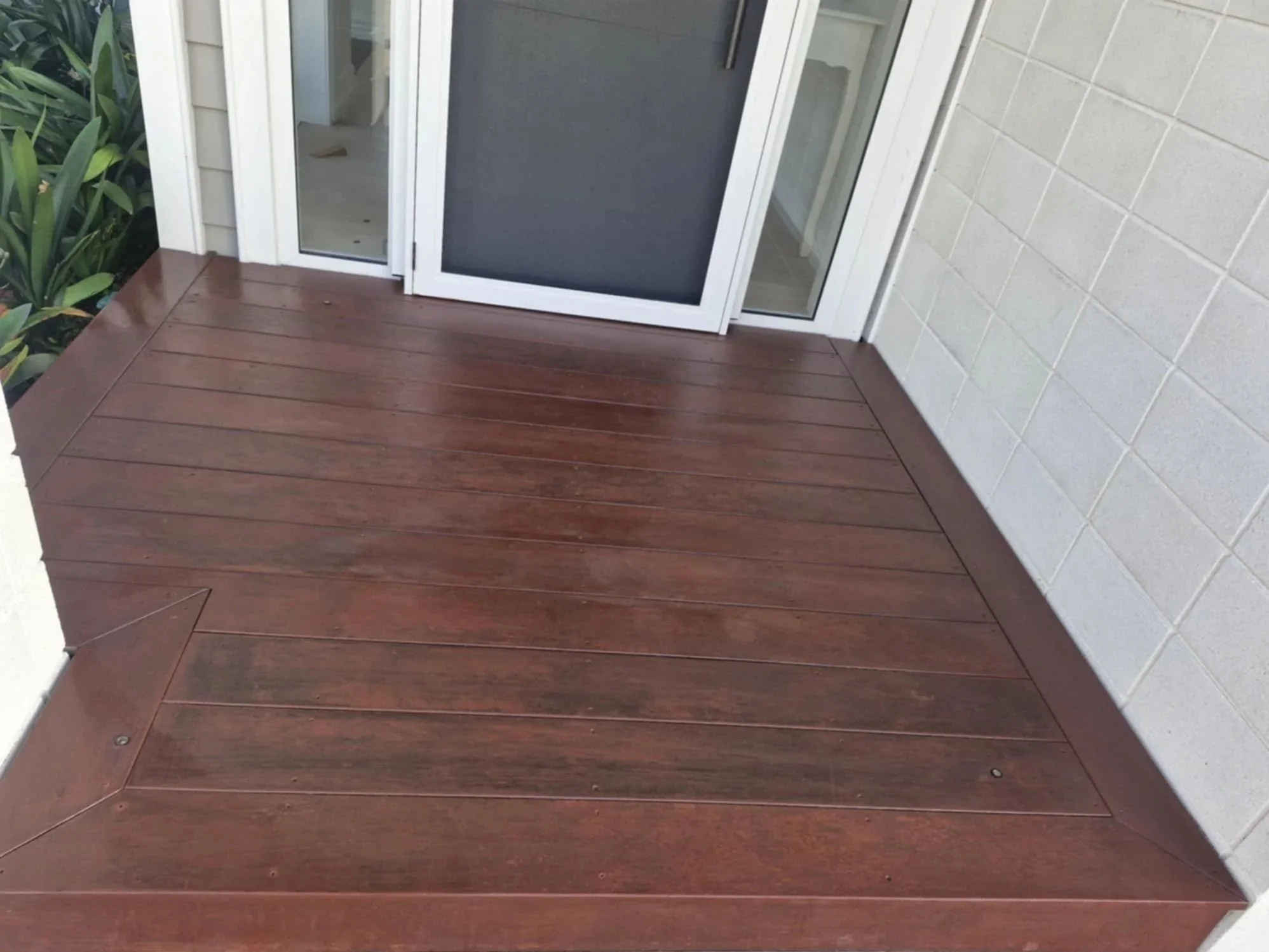 Home timber entrance porch after the scuff marks have been removed and treatments have been applied adding luster and protection.