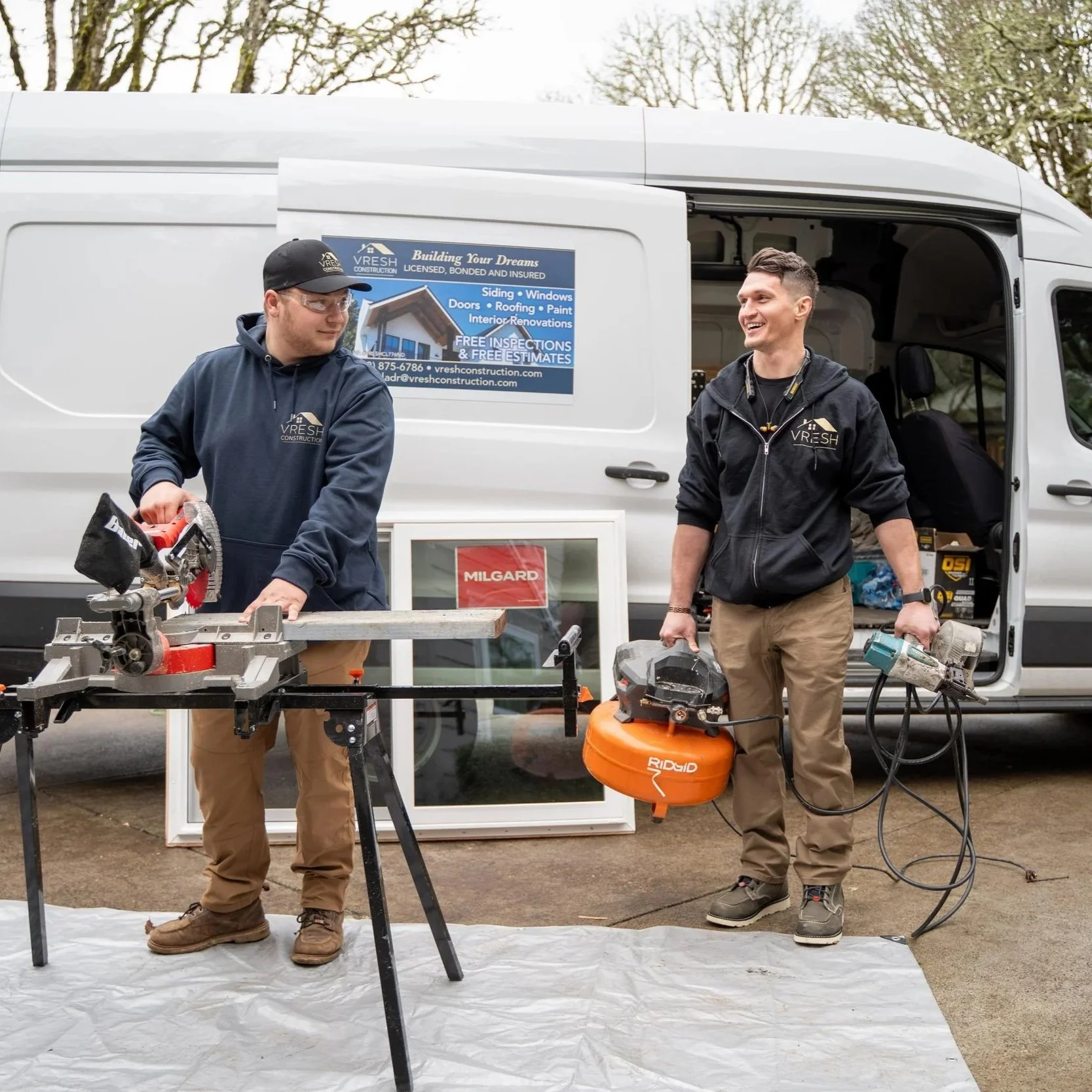 Contractors setting up tools outdoors, representing early intervention needed for roof leaks before prolonged moisture causes structural damage and expensive repairs.